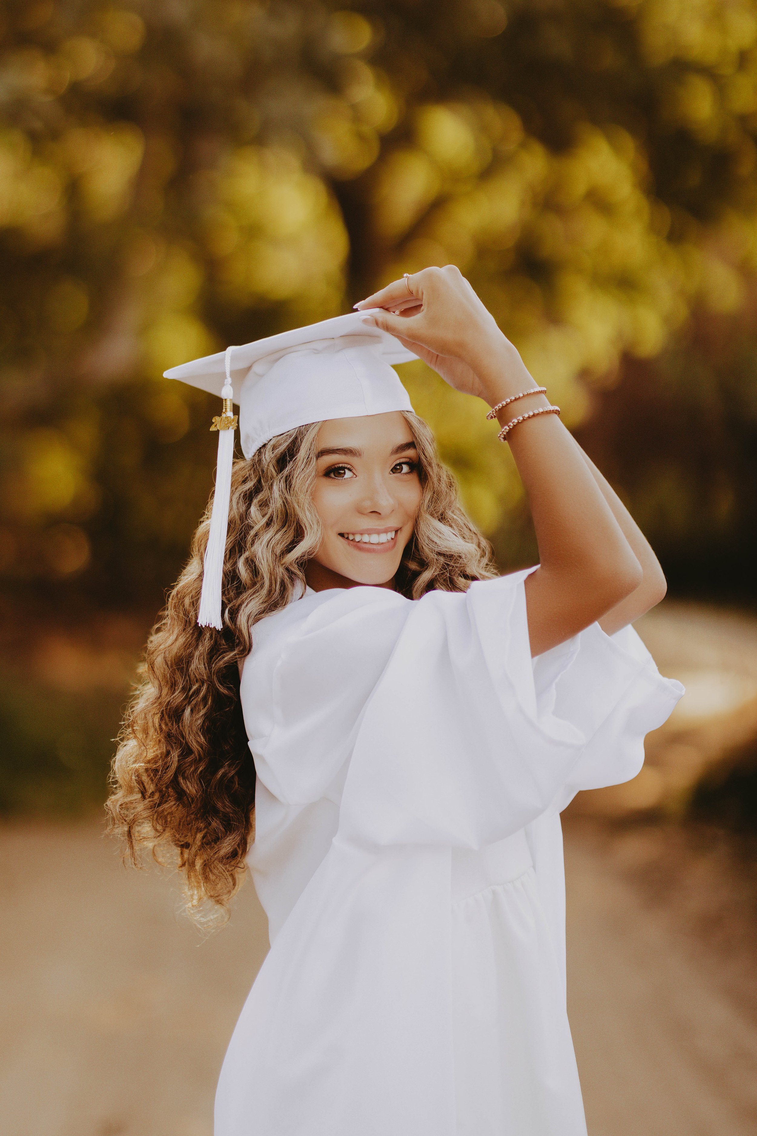  white cap and gown senior pictures 