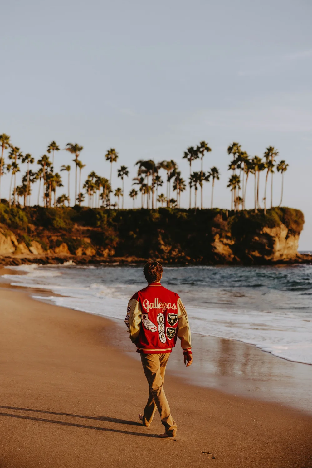 guy senior photo poses walking away 