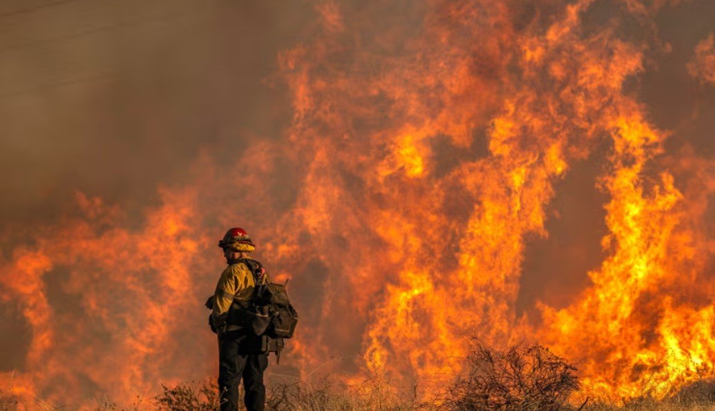 Three fires still burning as at least 16 people killed and more than 150,000 people remain under evacuation warning