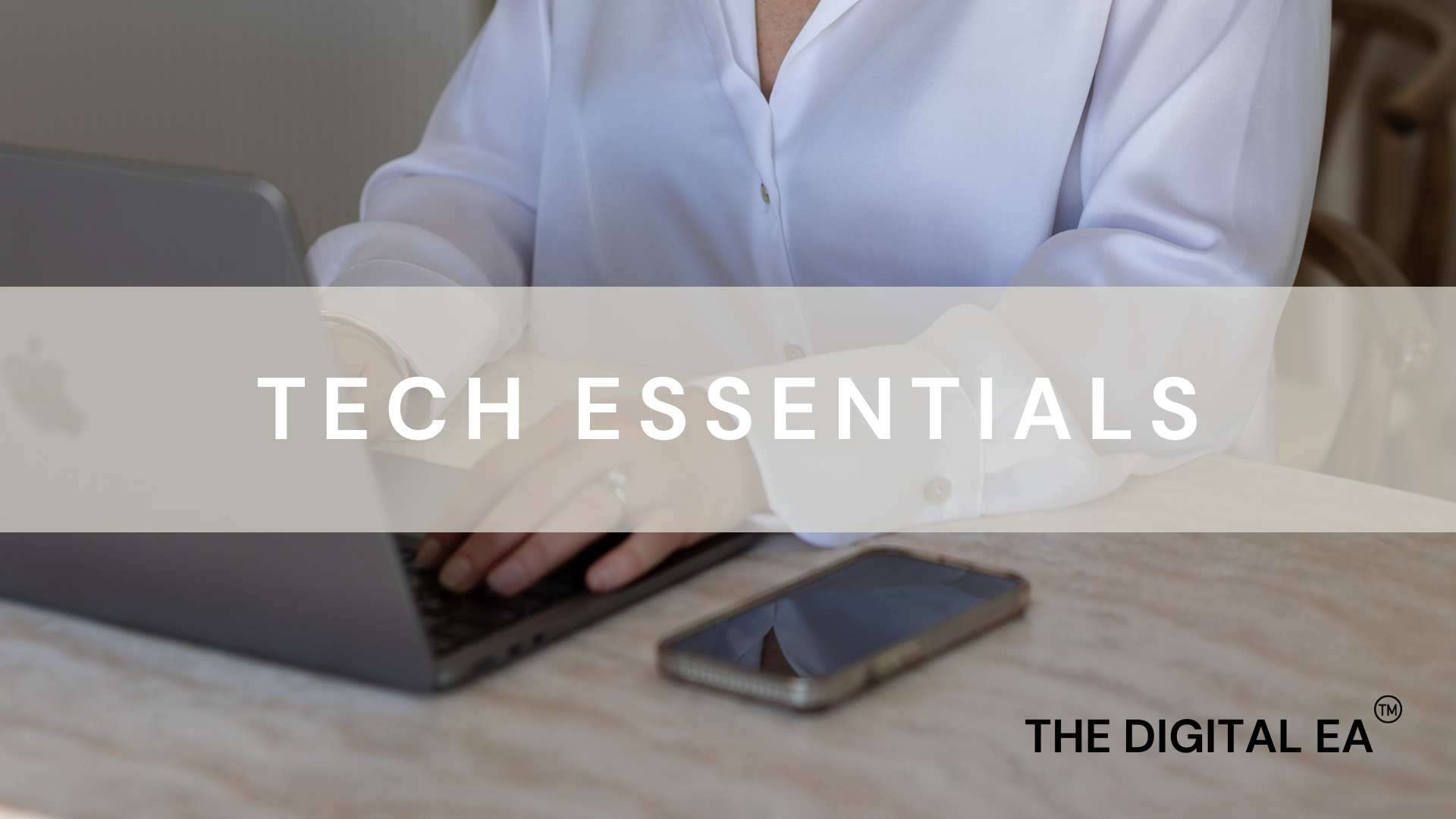 Jarrah Wallace - Kajabi Systems & Automations Partner.  Person in white shirt working on laptop at a wooden table with a smartphone nearby, promotional overlay for Tech Essentials by The Digital EA.