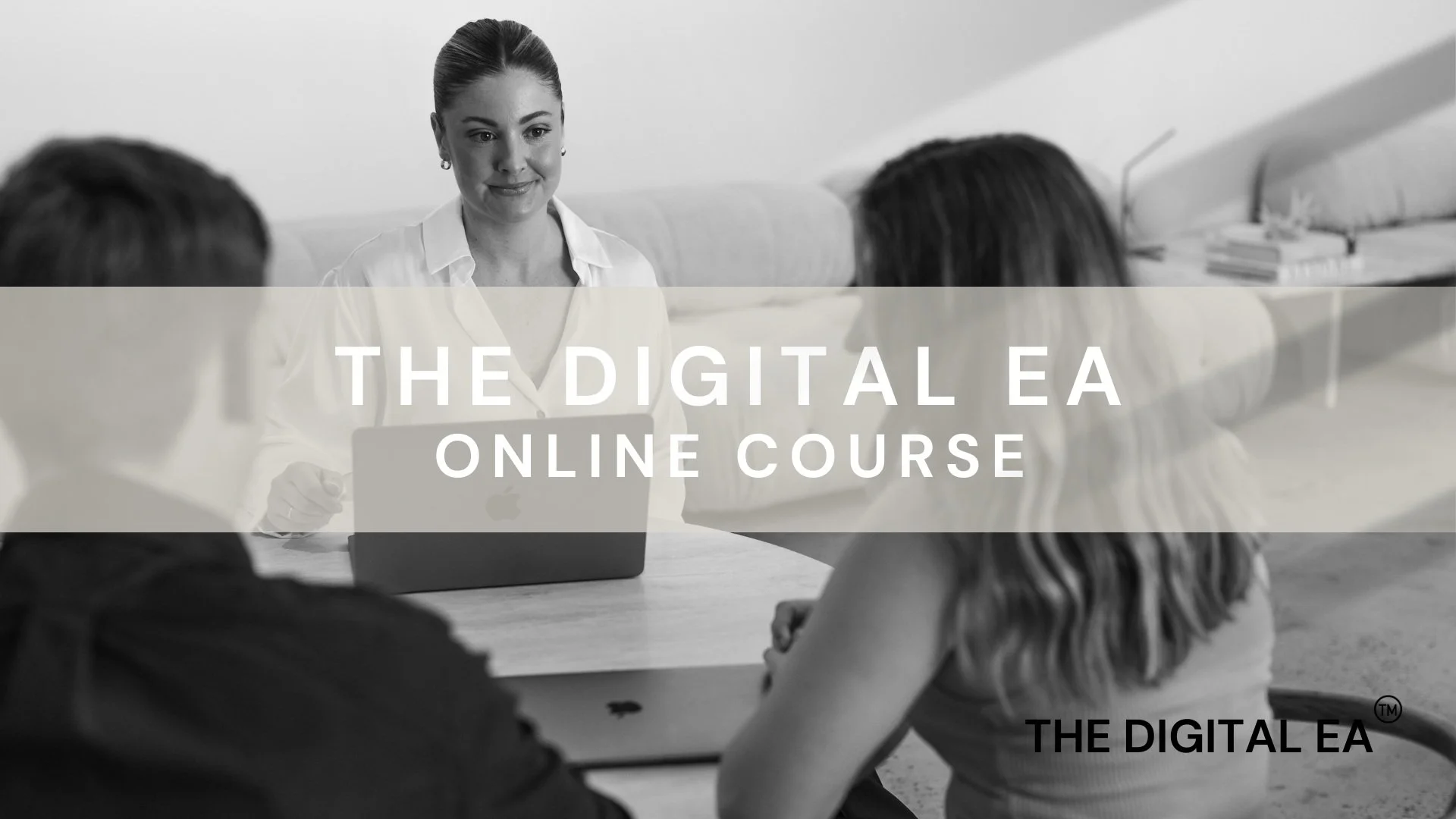 Jarrah Wallace - Kajabi Systems & Automations Partner.  Black and white photo of a woman with her hair in a bun, sitting at a desk, engaging with two people across from her in a meeting room. Text overlay reads "The Digital EA Online Course."