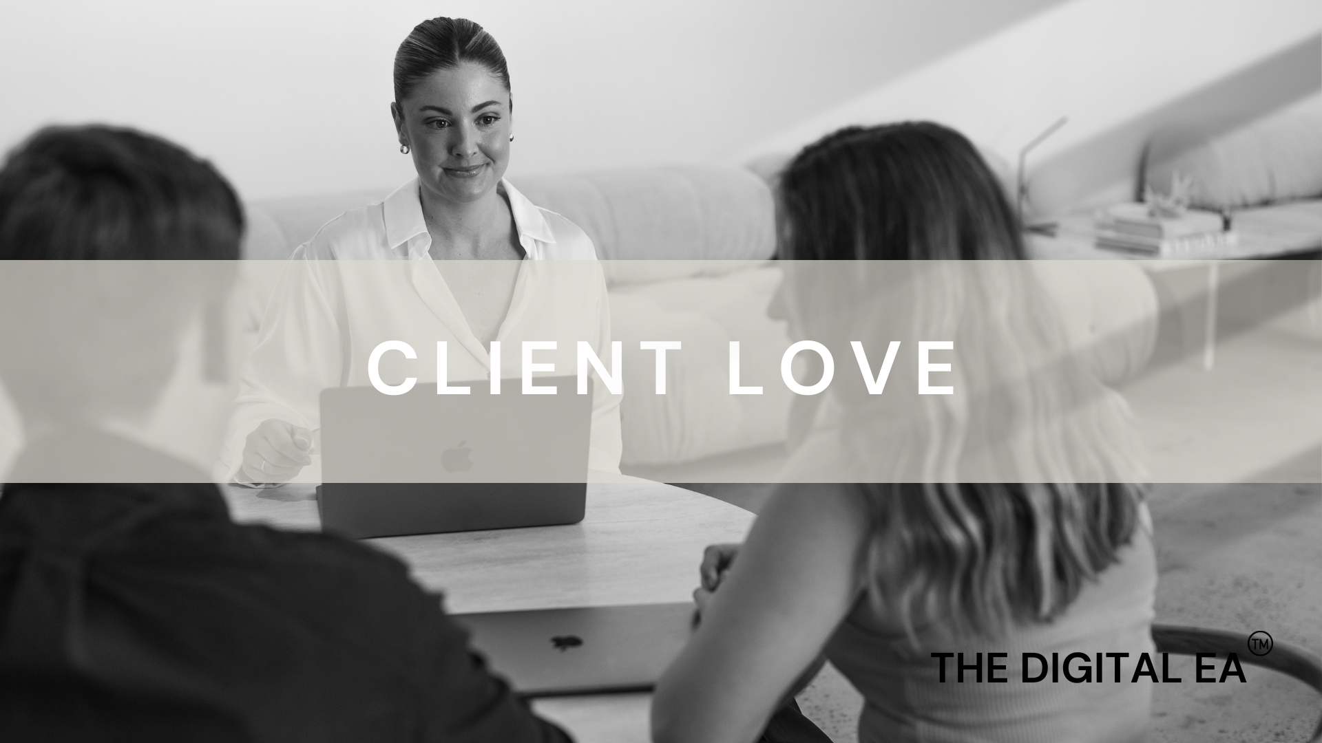Jarrah Wallace - Kajabi Systems & Automations PBlack and white photo of a woman in formal attire sitting at a table with three people across from her, in a modern office setting. The words 'CLIENT LOVE' and 'THE DIGITAL EA' are overlaid on the image.