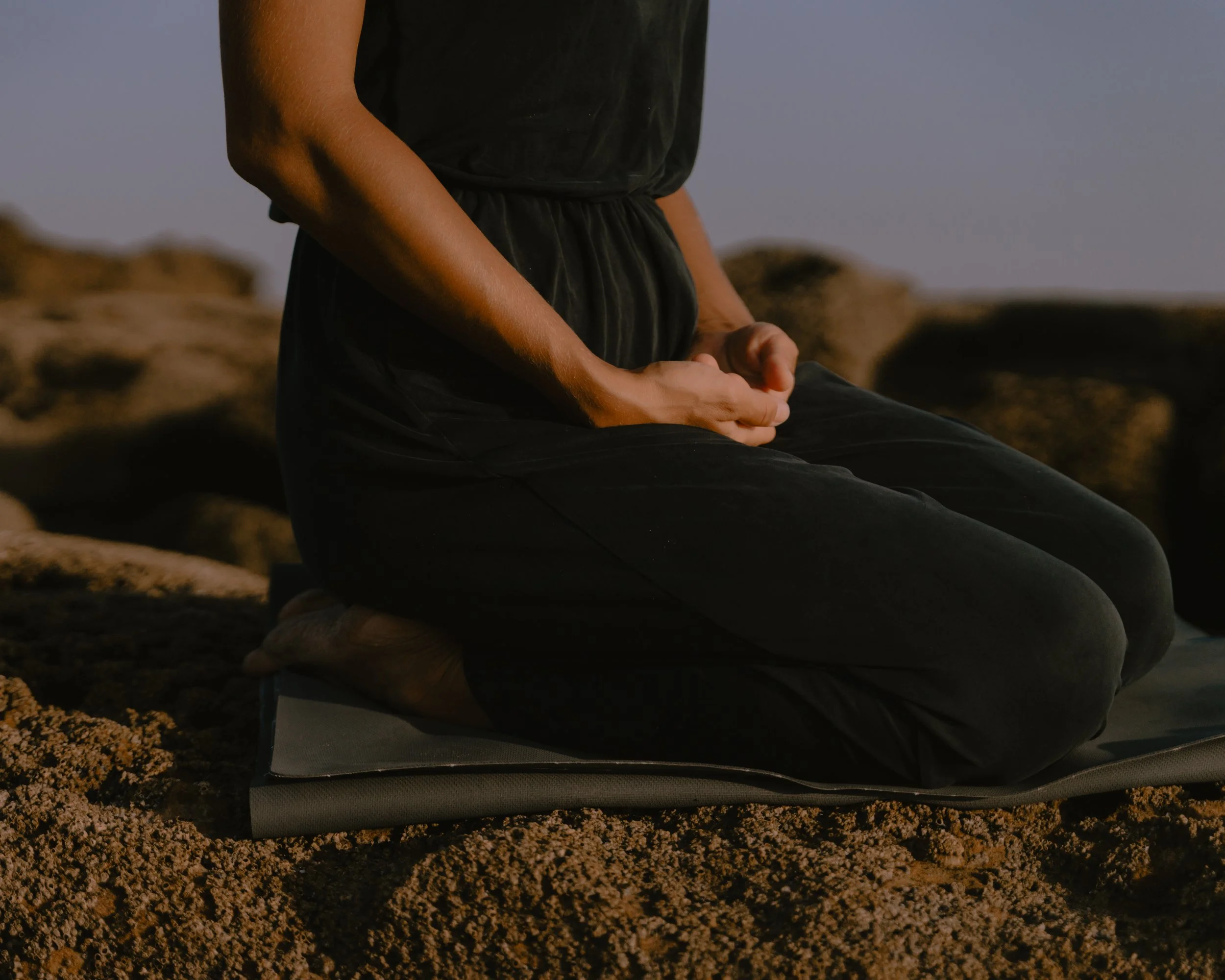 Kneeling Meditation Posture on Yoga Mat by the beach