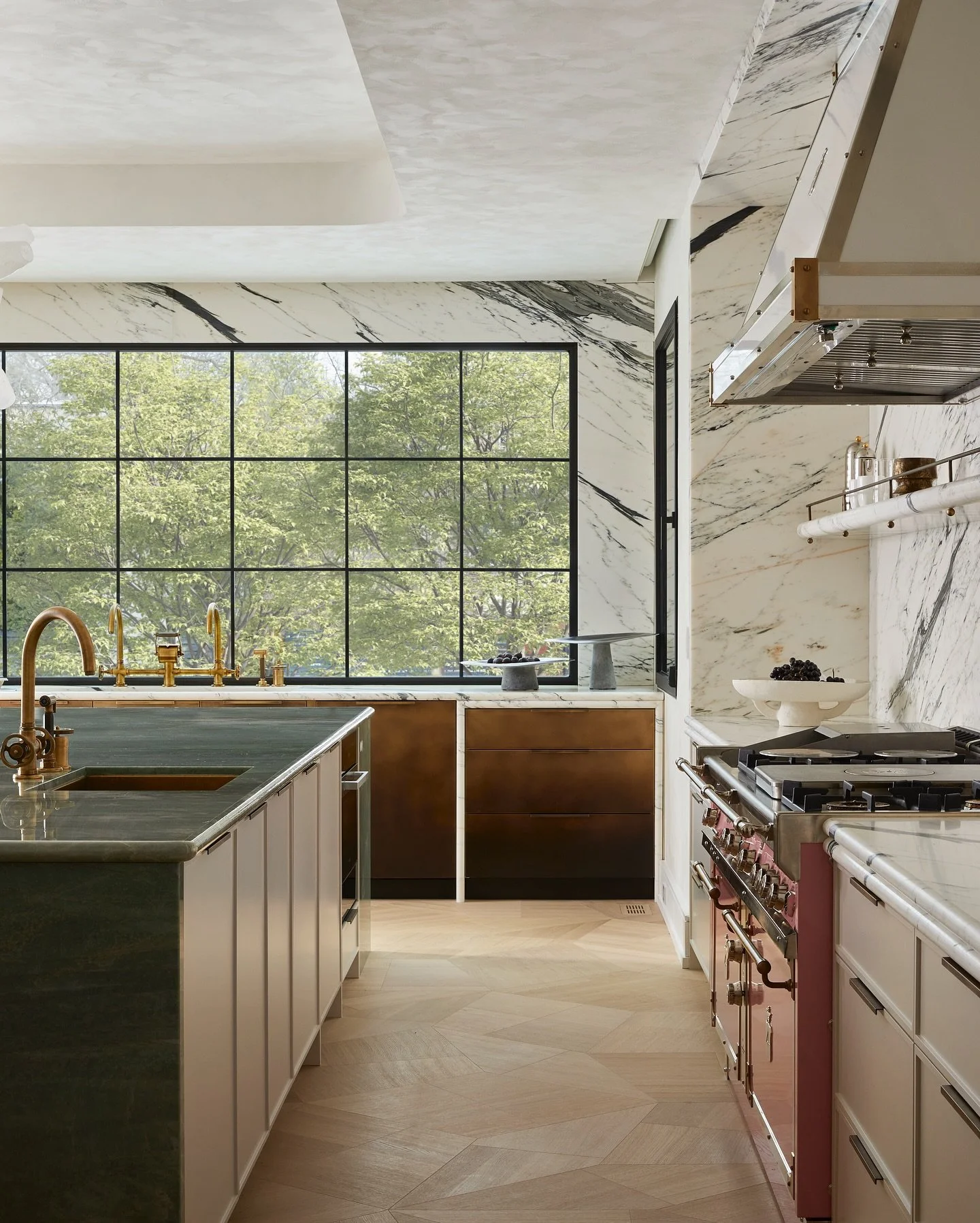 You can play with colour and still create a sophisticated, elegant and functional kitchen. Grounded in natural materials reimagined. Stone, burnished brass, wood, lacquer, inlay and views with light pouring in from every angle - this space represents