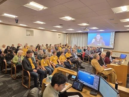 Roomful of people from around the state testifying to Make Polluters Pay