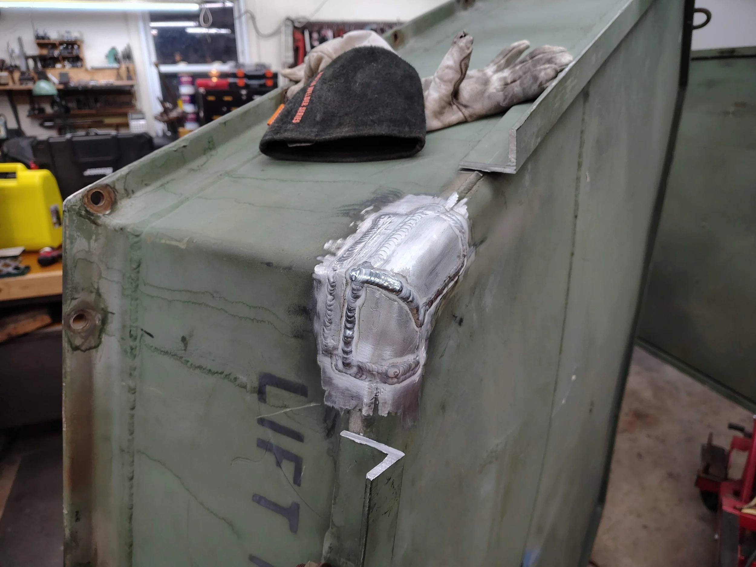 Completed aluminum weld repair patch on Boeing CH47 Chinook helicopter gas turbine engine part container. 6061 base material welded with 4047 filler wire. PIE LLC Weld and Machine, Warwick MD Cecil County.