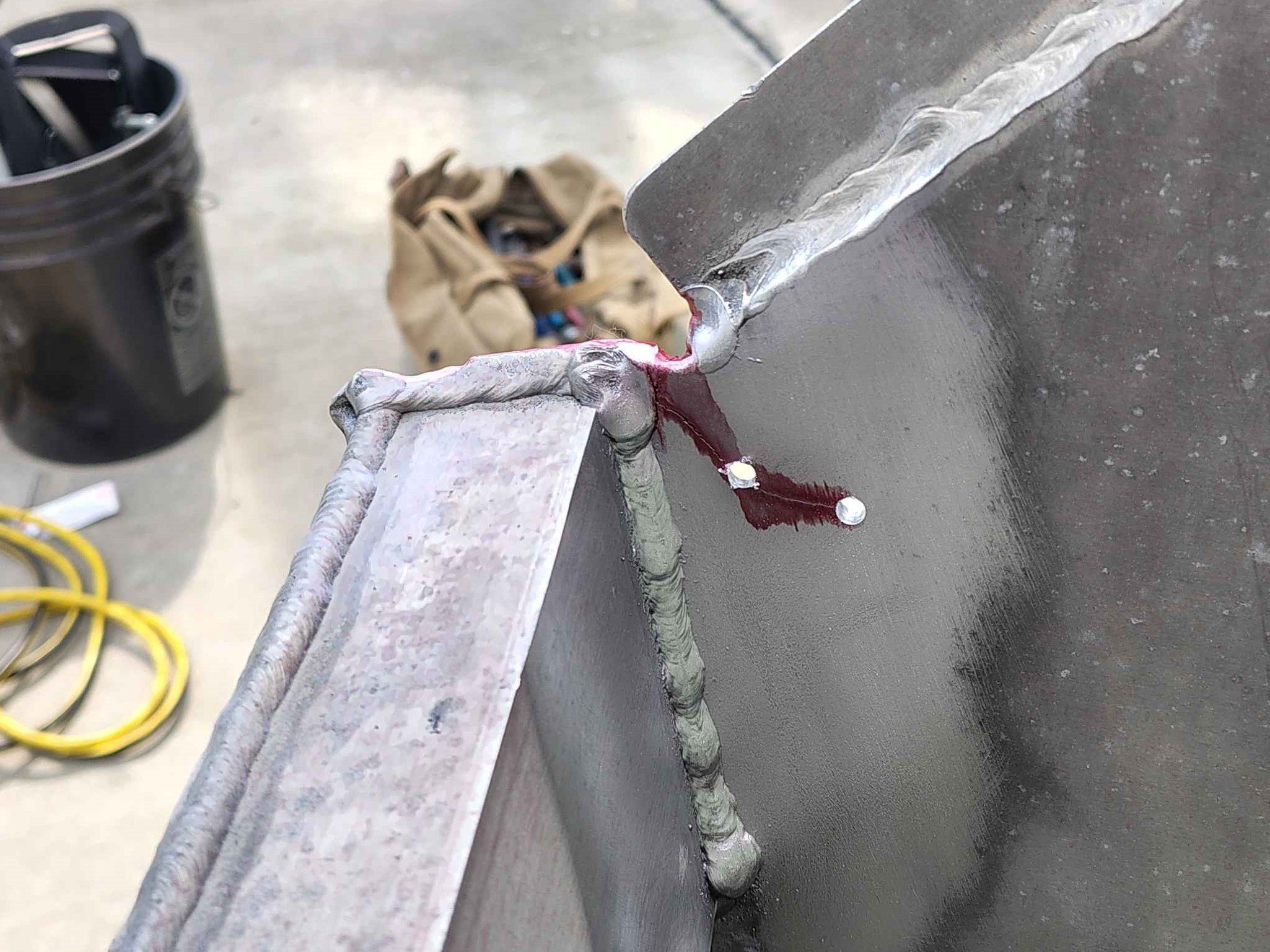 Stop drilled crack ends on aluminum boat transom prepared for TIG welding repair