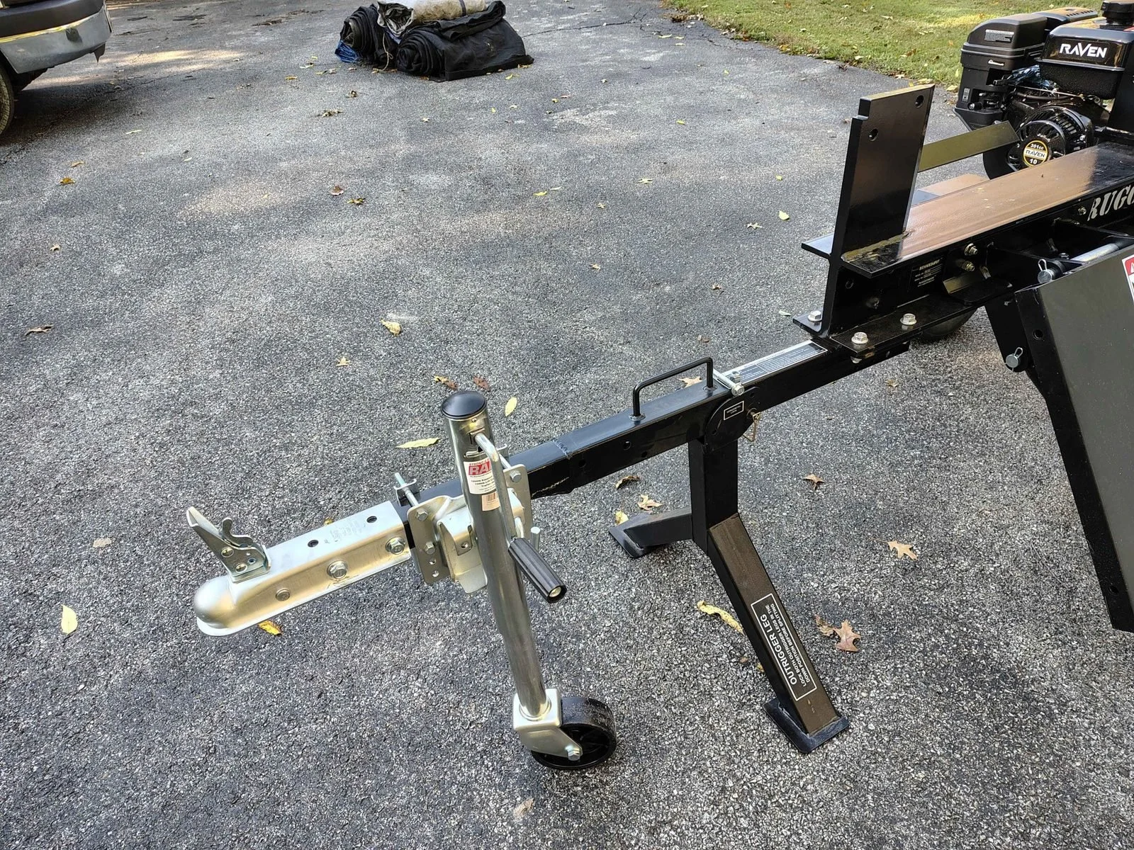 Log splitter tongue with new extension, trailer coupler and wheeled jack clear of the factory stand, by PIE Weld & Machine in the Chesapeake Bay region