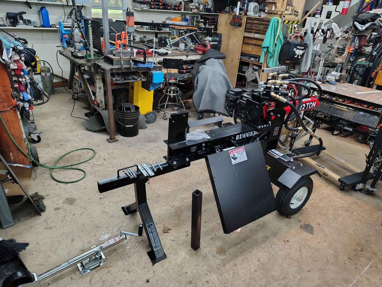 Rugged Split 22 ton log splitter in the PIE Weld & Machine shop in Cecil County, MD, before the trailer jack and tongue extension were installed