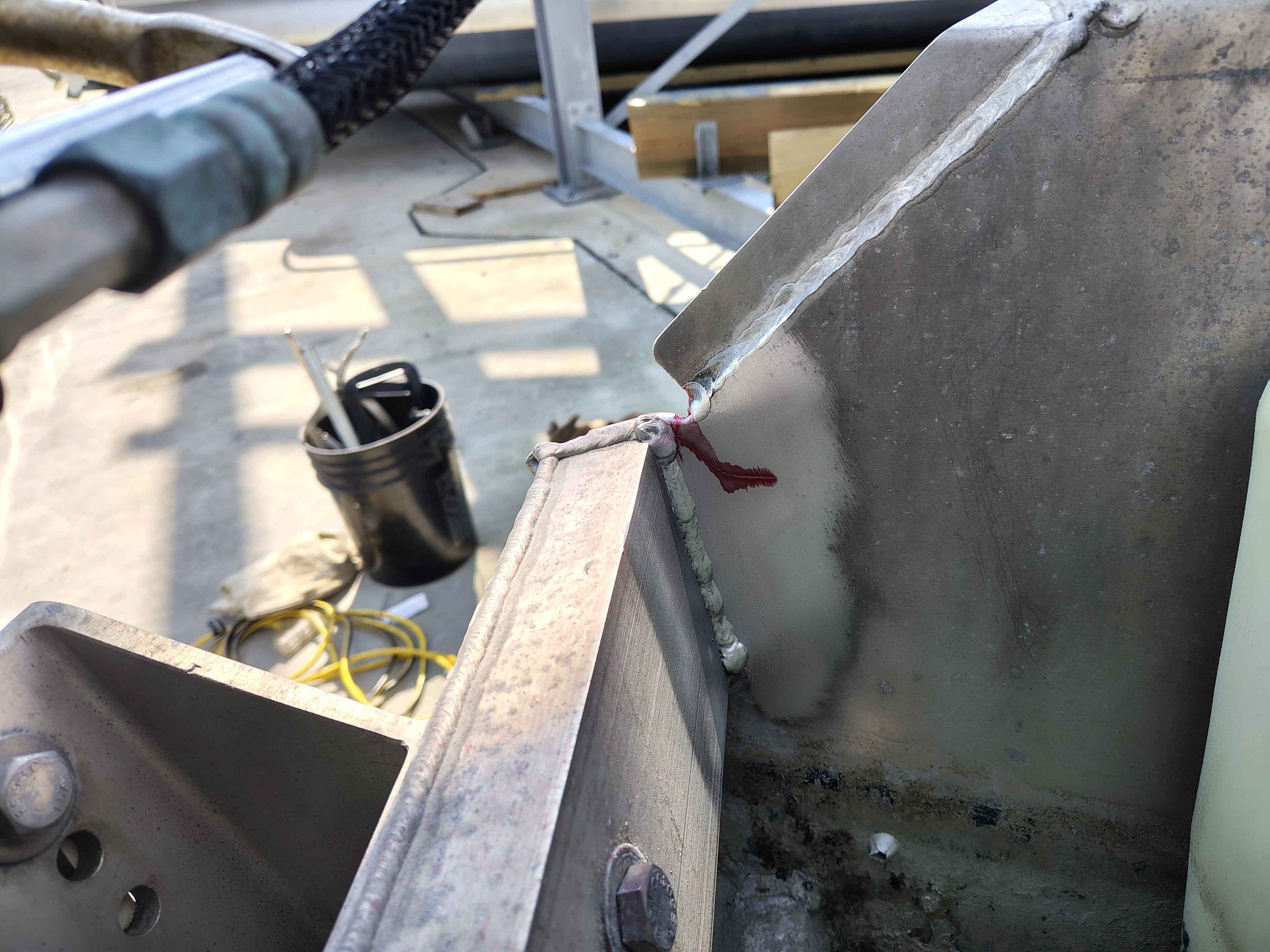 Dye penetrant revealing hidden crack extension on aluminum boat transom in Rehoboth Beach Delaware