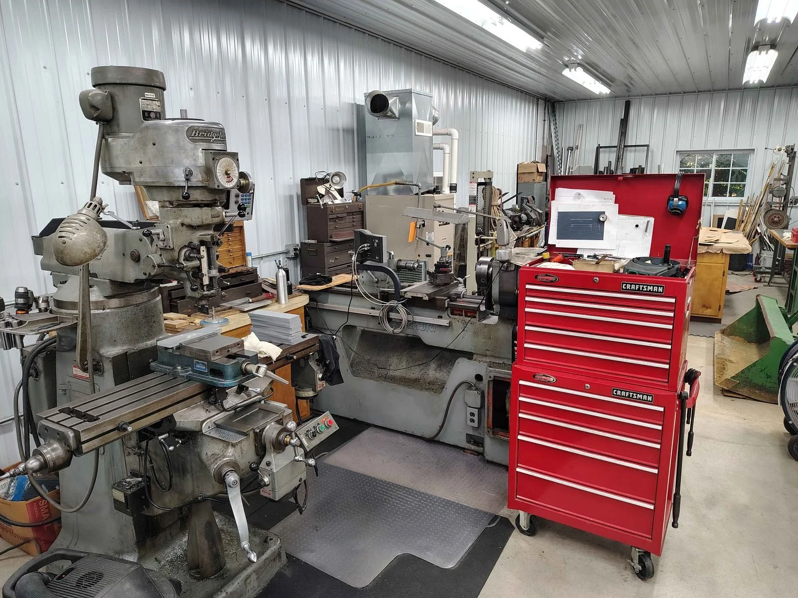 Inside the PIE Weld & Machine manual machine shop with a Bridgeport mill and Nishimori toolmakers lathe in Cecil County, MD