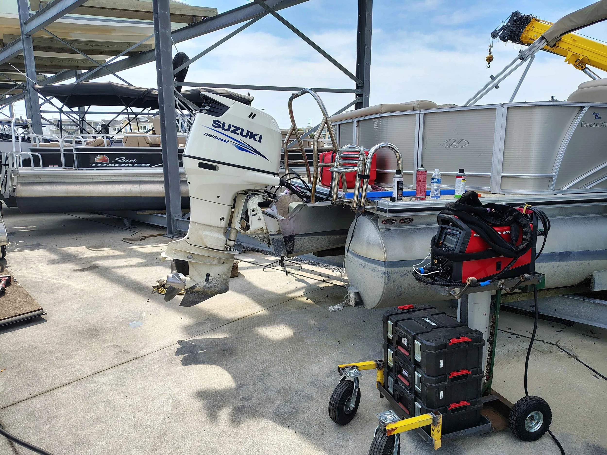 Mobile dockside aluminum welding on pontoon boat with outboard removed — marine repair serving Cecil County MD, Newark and Middletown DE, PIE LLC Weld & Machine