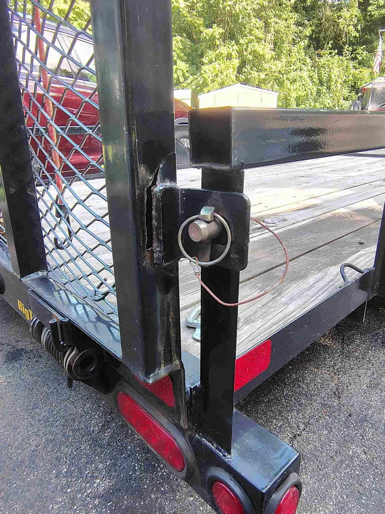 Torn coupler tab and cracked thin-wall box tube on a Big Tex steel trailer before repair — steel trailer frame repair, PIE LLC Weld & Machine, Cecil County MD serving Maryland and Delaware