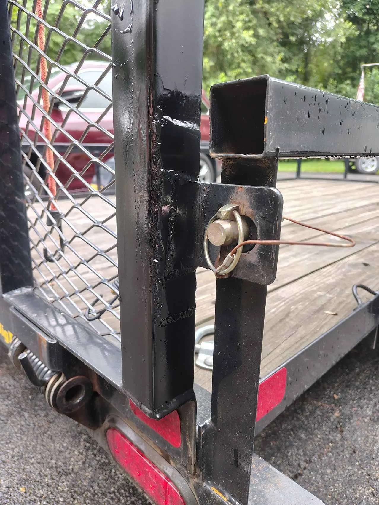 Completed steel trailer coupler tab repair coated in gloss black to prevent rust — steel trailer frame repair, PIE LLC Weld & Machine, Cecil County MD serving Maryland and Delaware