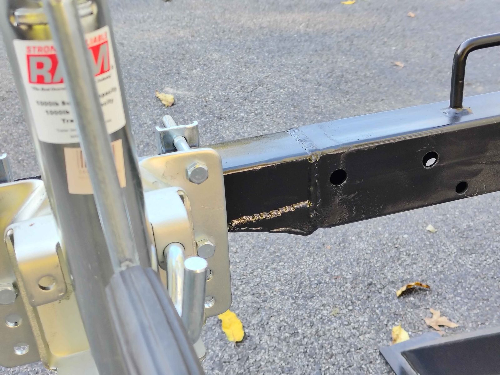 Swivel trailer jack mounted on a custom welded log splitter tongue extension by PIE Weld & Machine, serving Delaware