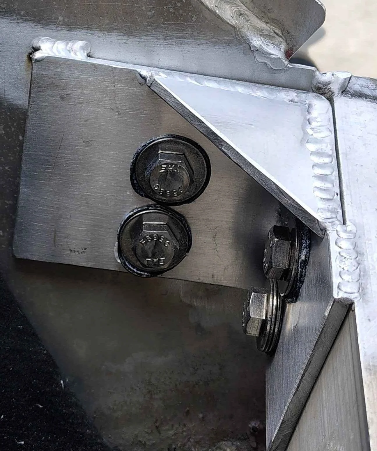 Bolted aluminum reinforcement plate with tack welded top edge left removable on boat transom in Delaware