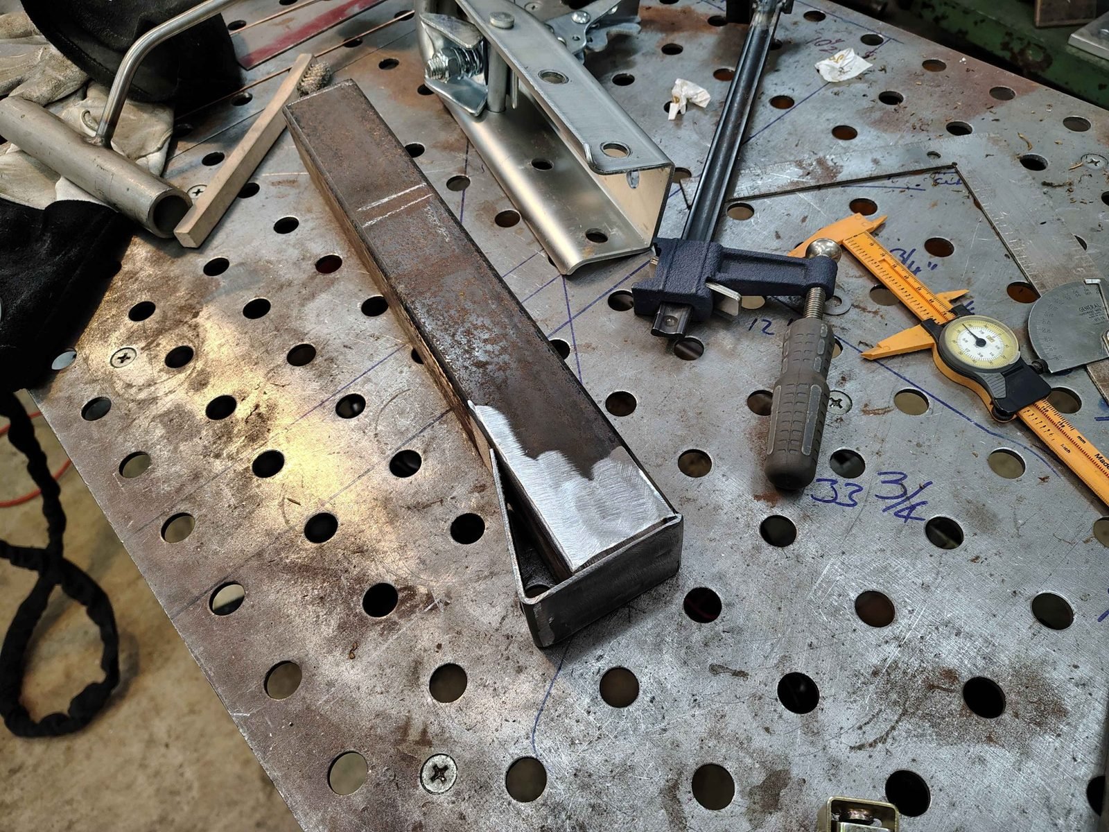 Bent 1/8 inch steel plate fitted to the end of 2x2 steel tube to form a 2x3 transition, fabricated by PIE Weld & Machine in Cecil County, MD