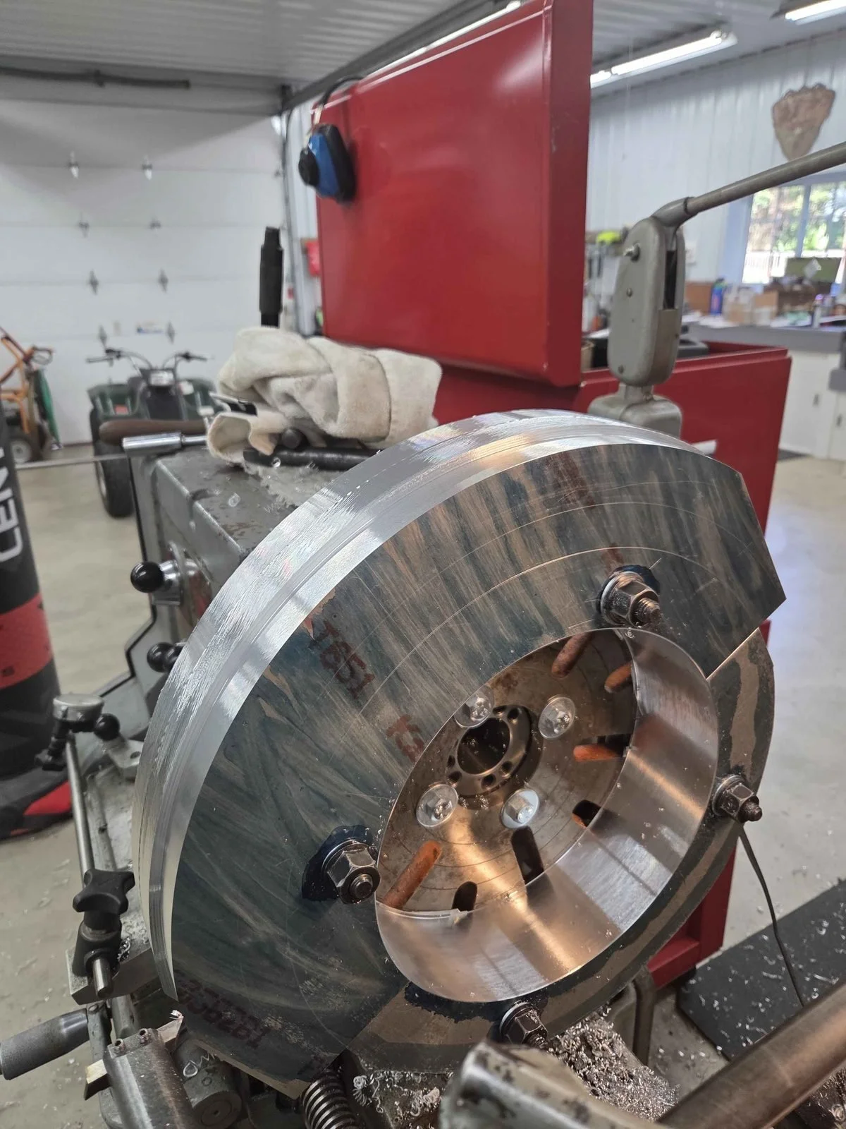Aluminum split ring refueling probe mount for a CH-47 Chinook helicopter being faced and turned on the lathe at PIE Weld & Machine in Cecil County, MD