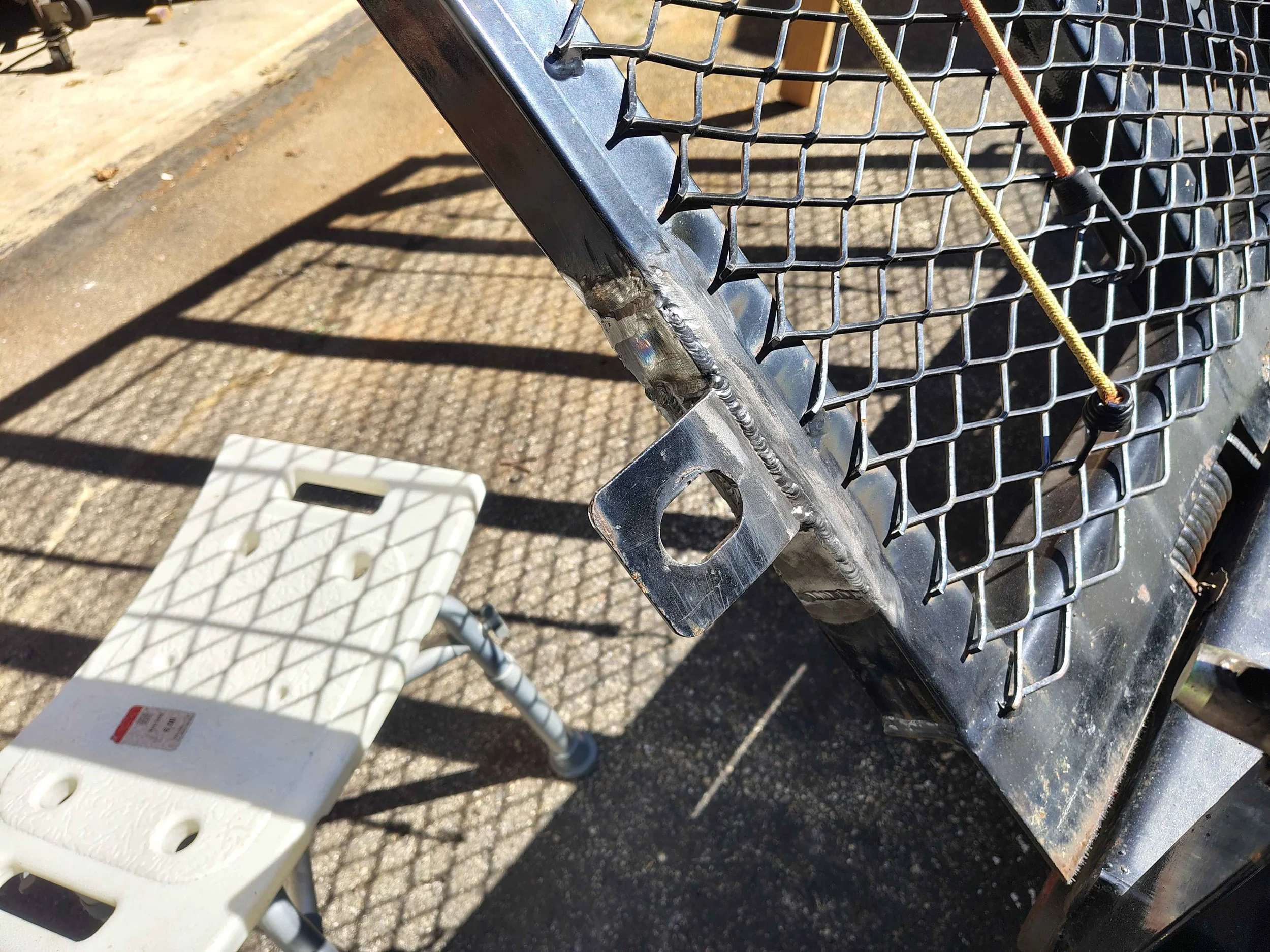 Coupler tab reinforced with 1/8 inch steel plate patches fillet-welded on three sides for added strength — steel trailer frame repair, PIE LLC Weld & Machine, Cecil County MD serving Maryland and Delaware