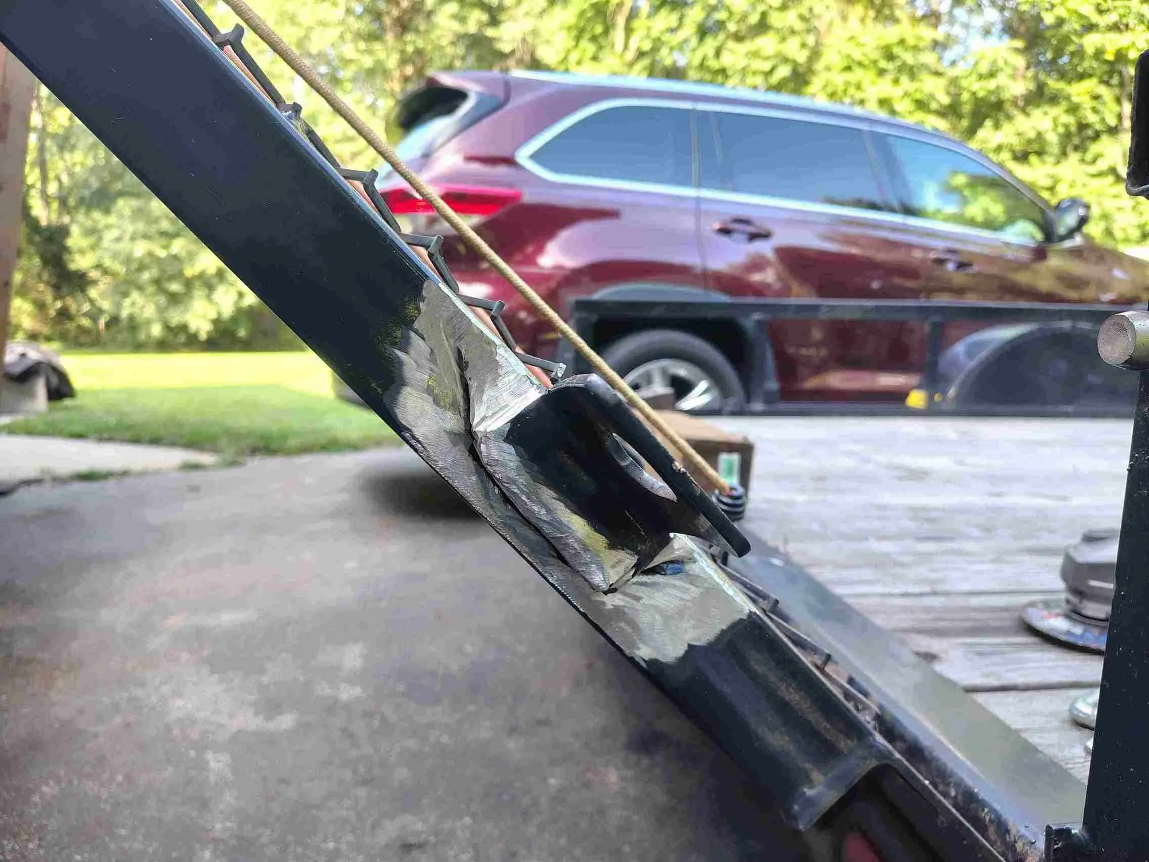 Trailer frame tab area cleaned and stripped of powder coating in preparation for TIG welding — steel trailer repair, PIE LLC Weld & Machine, Cecil County MD serving Maryland and Delaware