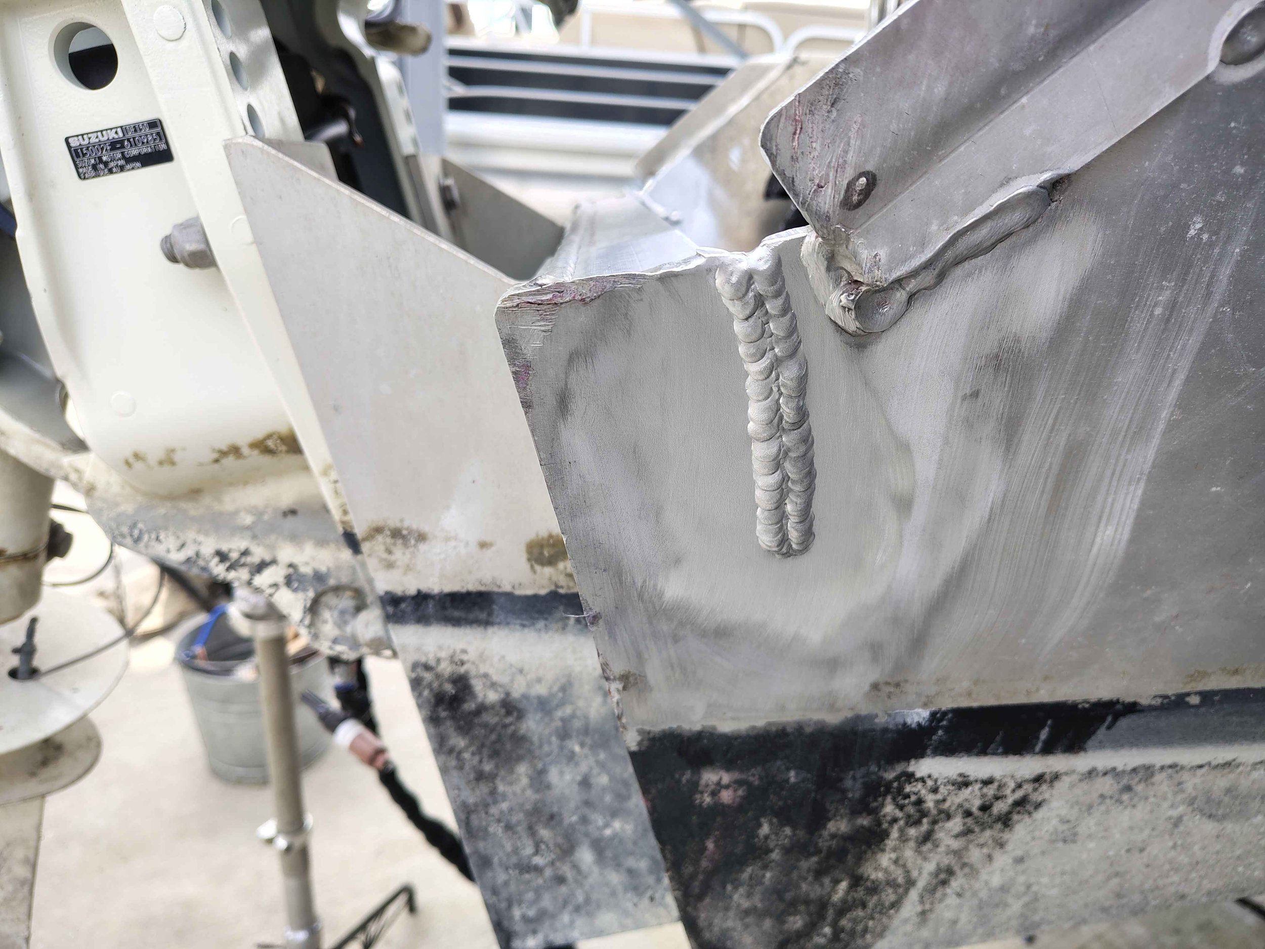 Close up of finished aluminum TIG weld bead on boat transom repair in Rehoboth Beach