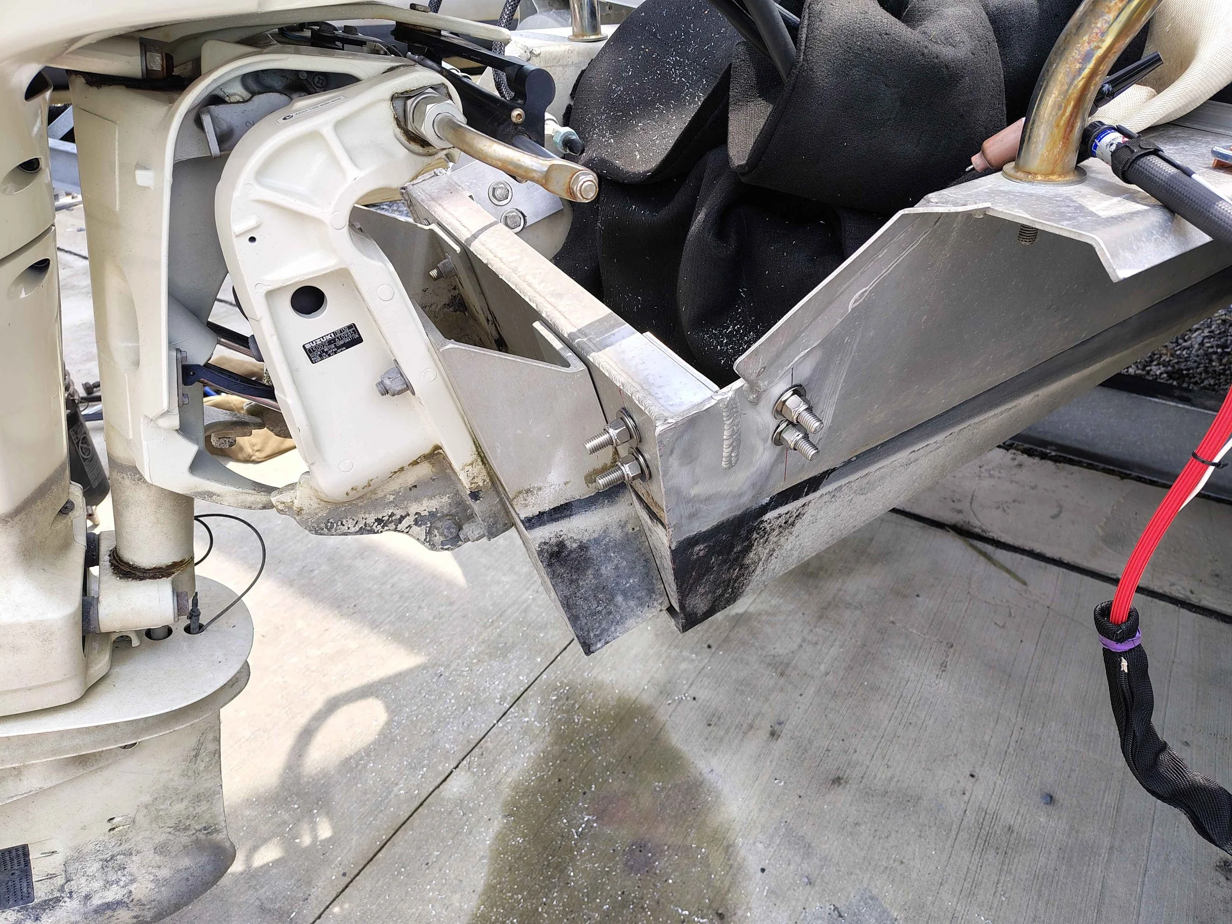 Completed aluminum boat transom repair with both reinforcement plates installed and outboard remounted in Rehoboth Beach Delaware