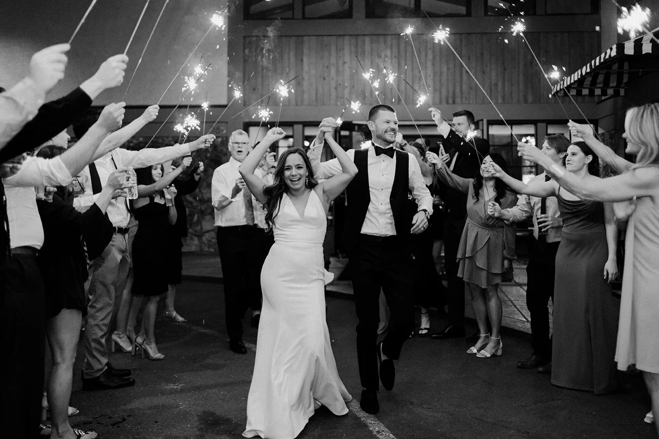 A joyful couple celebrating and dancing at their wedding, representing long-term relationship satisfaction and shared commitment.
