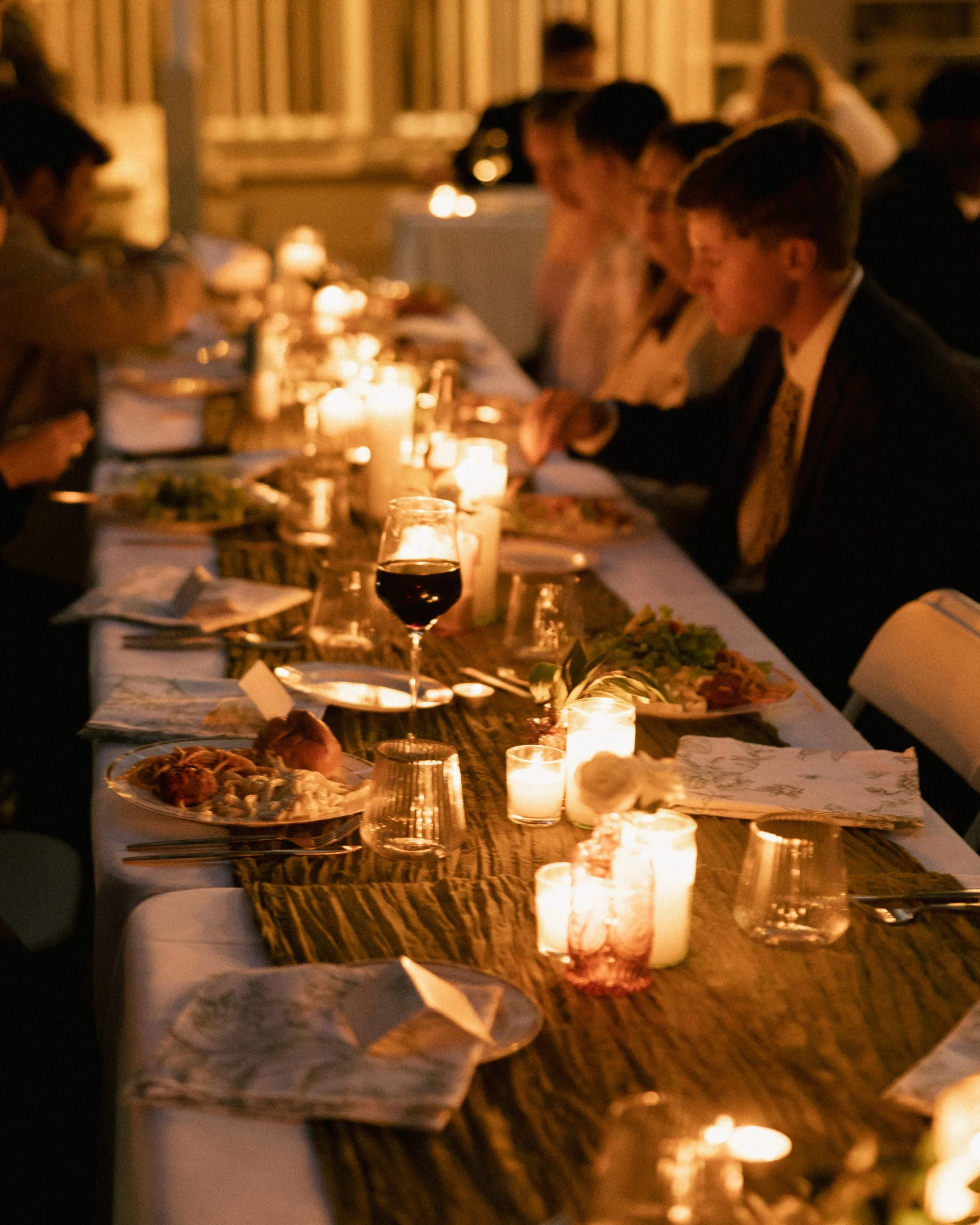 the feeling, the ambiance.

I love a good flash photo as much as the next person&hellip; BUT I am a SUCKER for shooting reception spaces with no flash. 

I love how the ambiance is preserved, the moodiness, the lighting, the candles flickering, the b