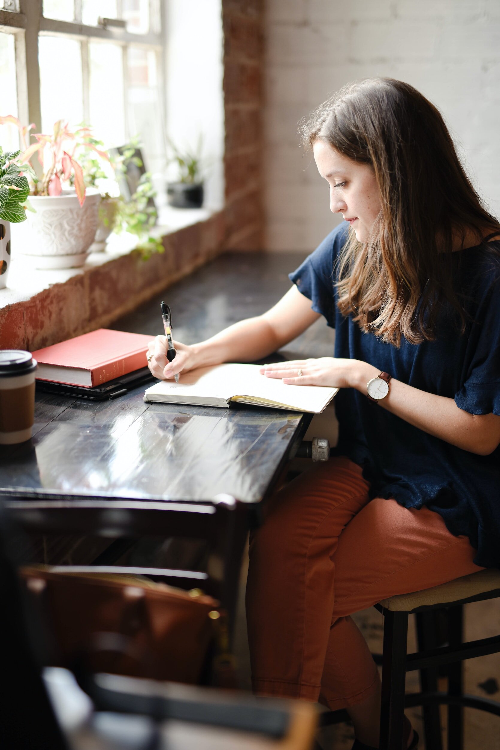 Woman journaling and sharing her favorite pet stories