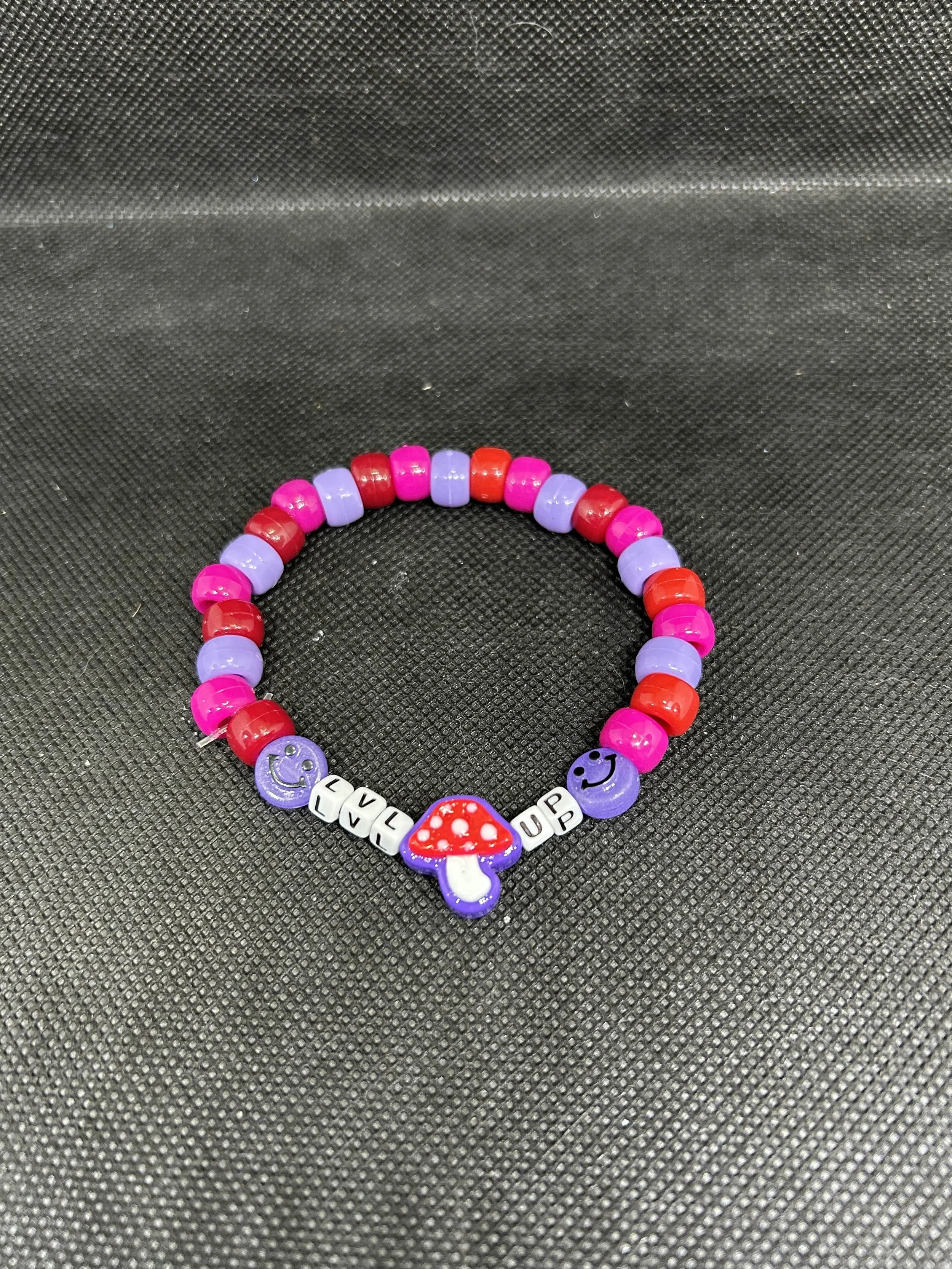 “LVL UP” Kandi Single Bracelet | Red, Pink & Purple Beads with Mushroom & Smiley Charms