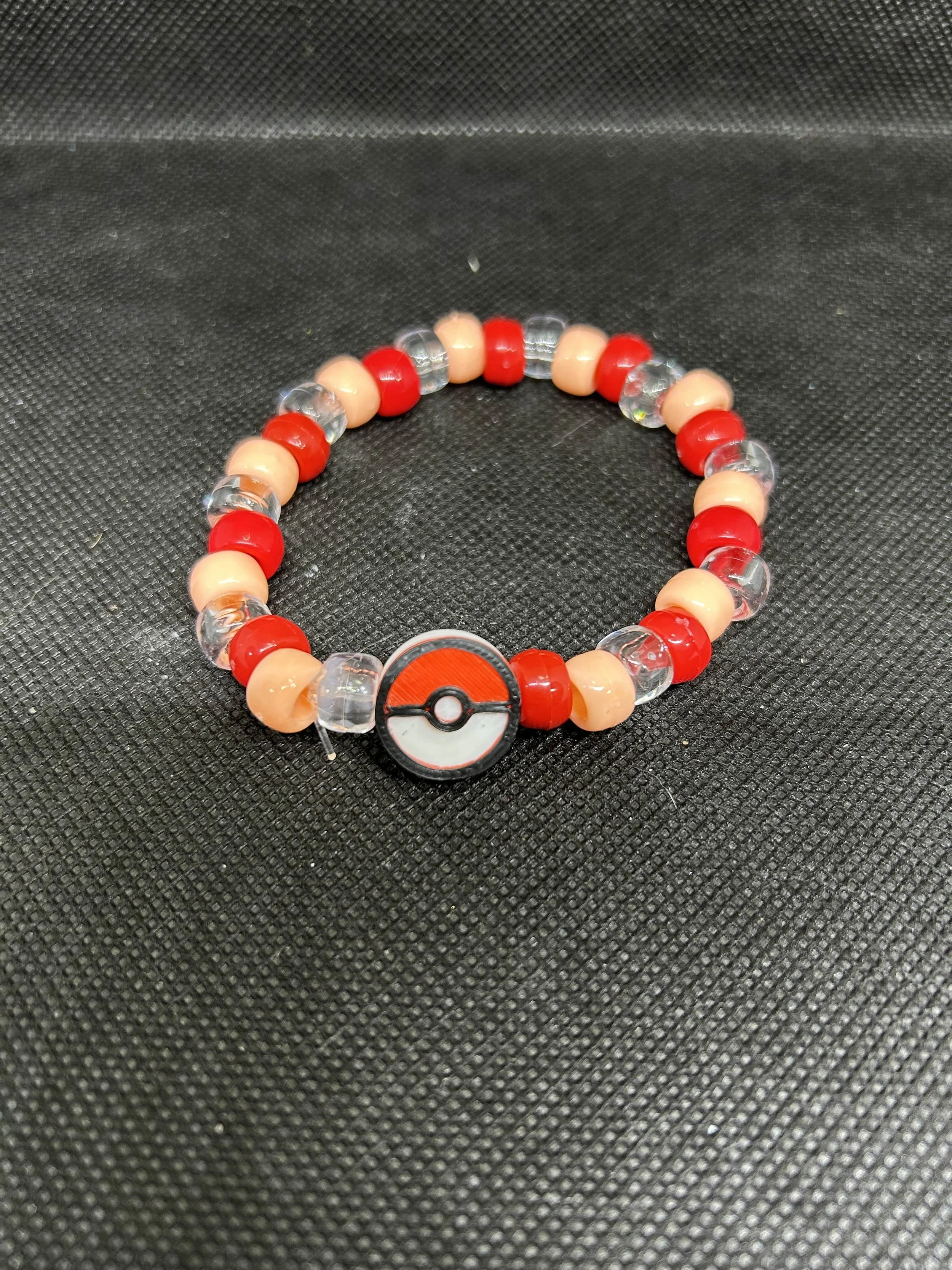 “Poké Ball” Kandi Bracelet | Red, Peach & Clear Beaded Rave Single with Pokémon Charm
