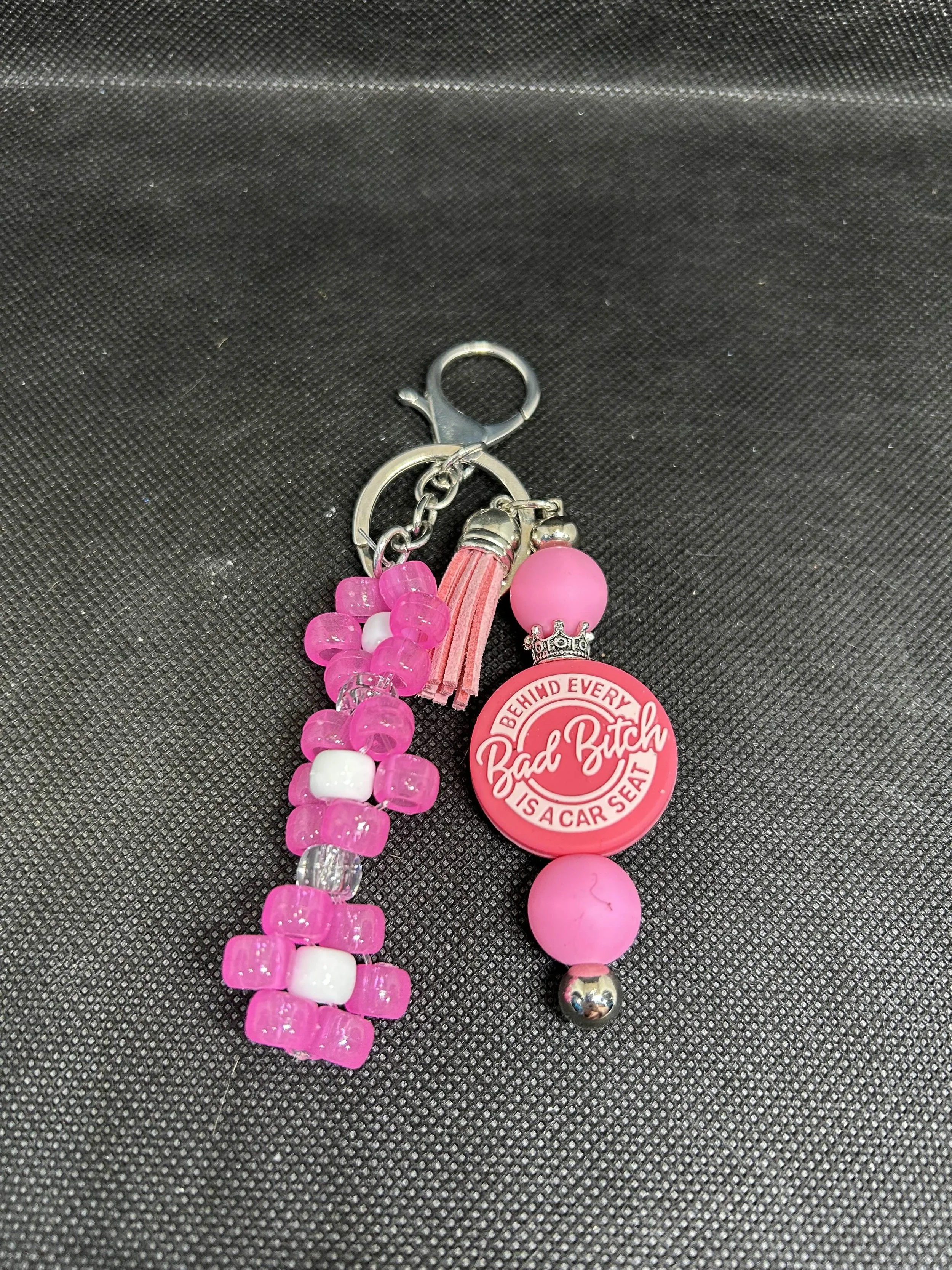 “Behind Every Bad Bitch Is a Car Seat” Keychain | Funny Mom Accessory with Tassel & Beads