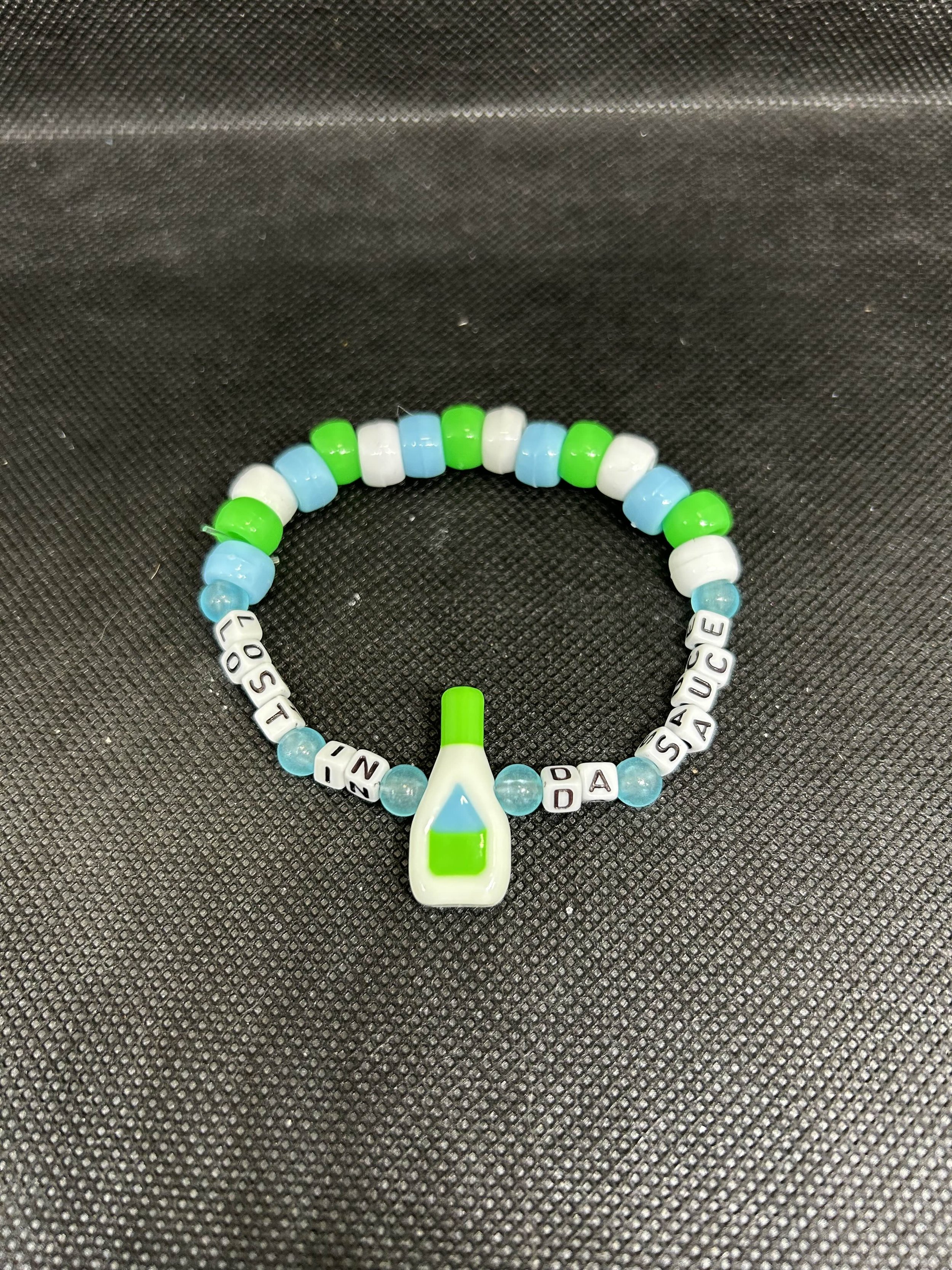 “LOST IN DA SAUCE” Kandi Bracelet –| Green, White & Blue Beaded Rave Single with Ranch Bottle Charm