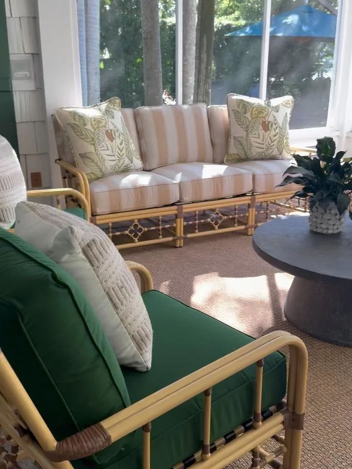 Every home tells a story and this porch has been welcoming guests for generations ☀️ We brought in timeless furniture, rich green upholstery and pops of patterns to draw the outdoors in, adding warmth and personality. Just add good company and a glas