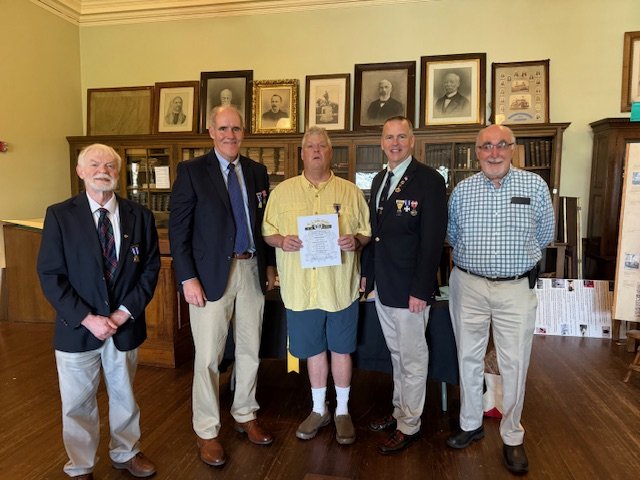 A new Brother joiins camp 54, presented his certificate by Camp Commander Glidden and Department Commander Fraser