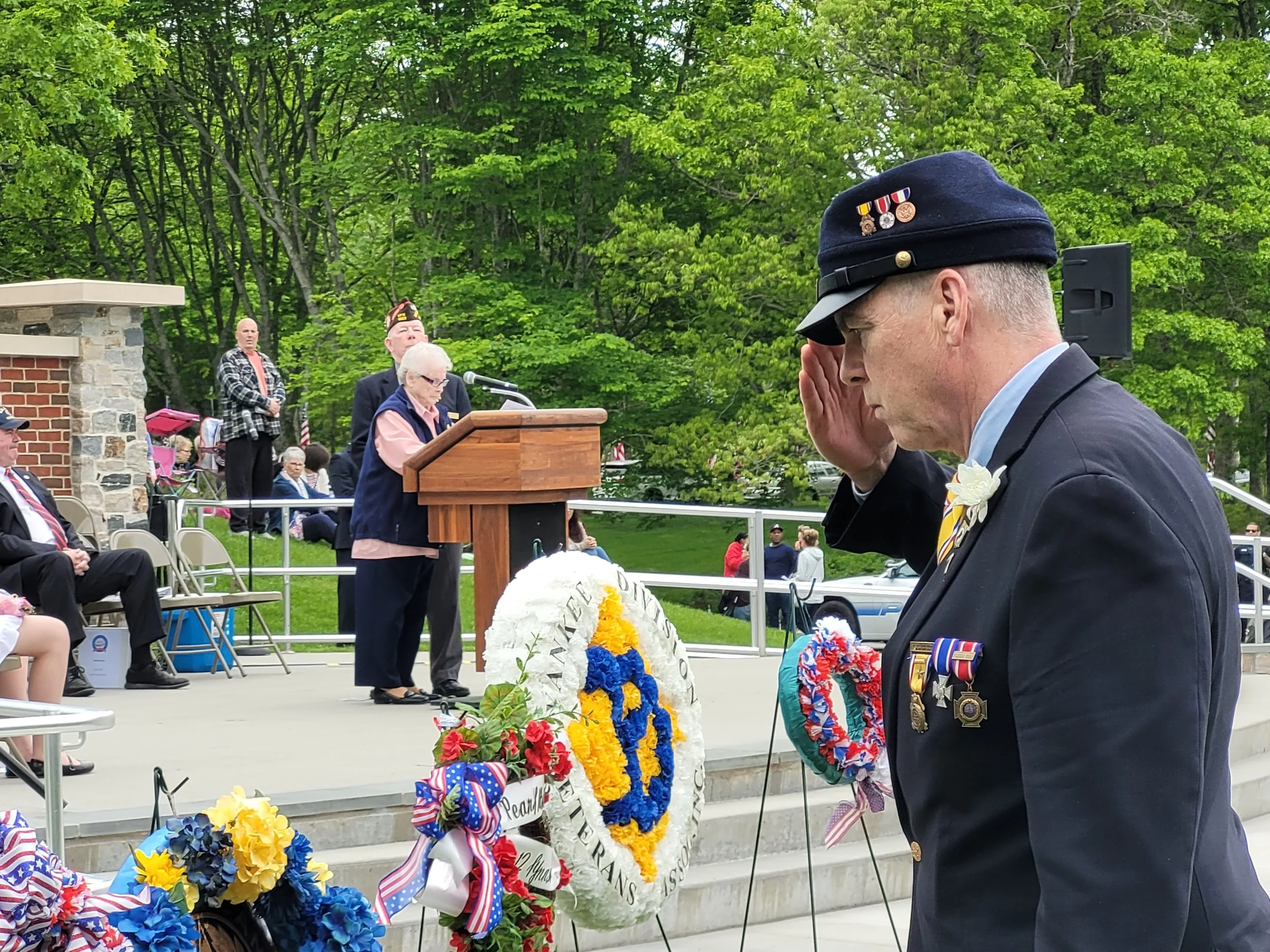 Commander Fraser placing a wreath at the National Cemetery in Boune on Memoiral Day