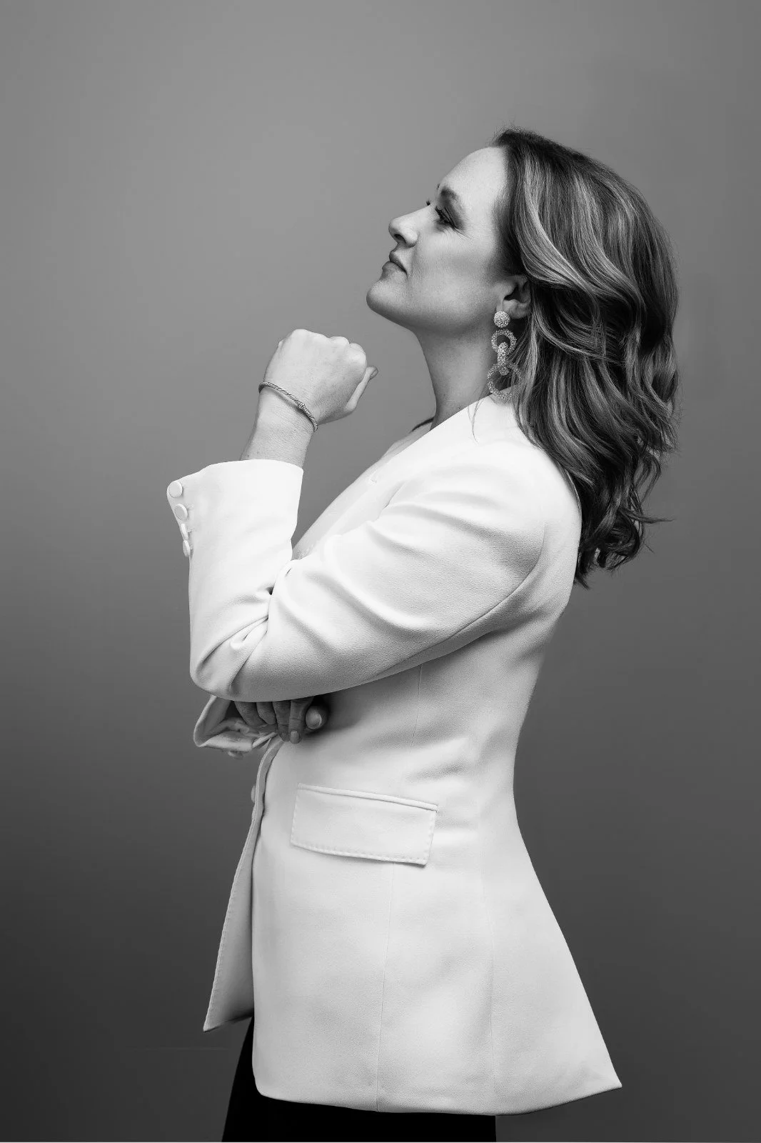 Amanda Johansen, career coach for high achievers, in a white blazer