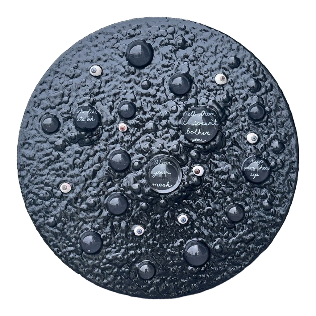 Boiling Point: Wear Your Mask, 2026. Glass domes, prosthetic glass eyes, and acrylic on panel. 24 inches diameter