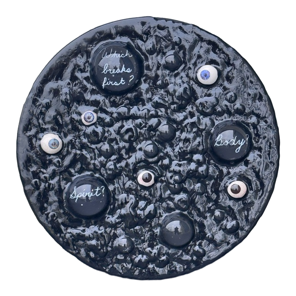 Boiling Point: Which Breaks First?, 2026. Glass domes, prosthetic glass eyes, and acrylic on panel. 12 inches diameter 