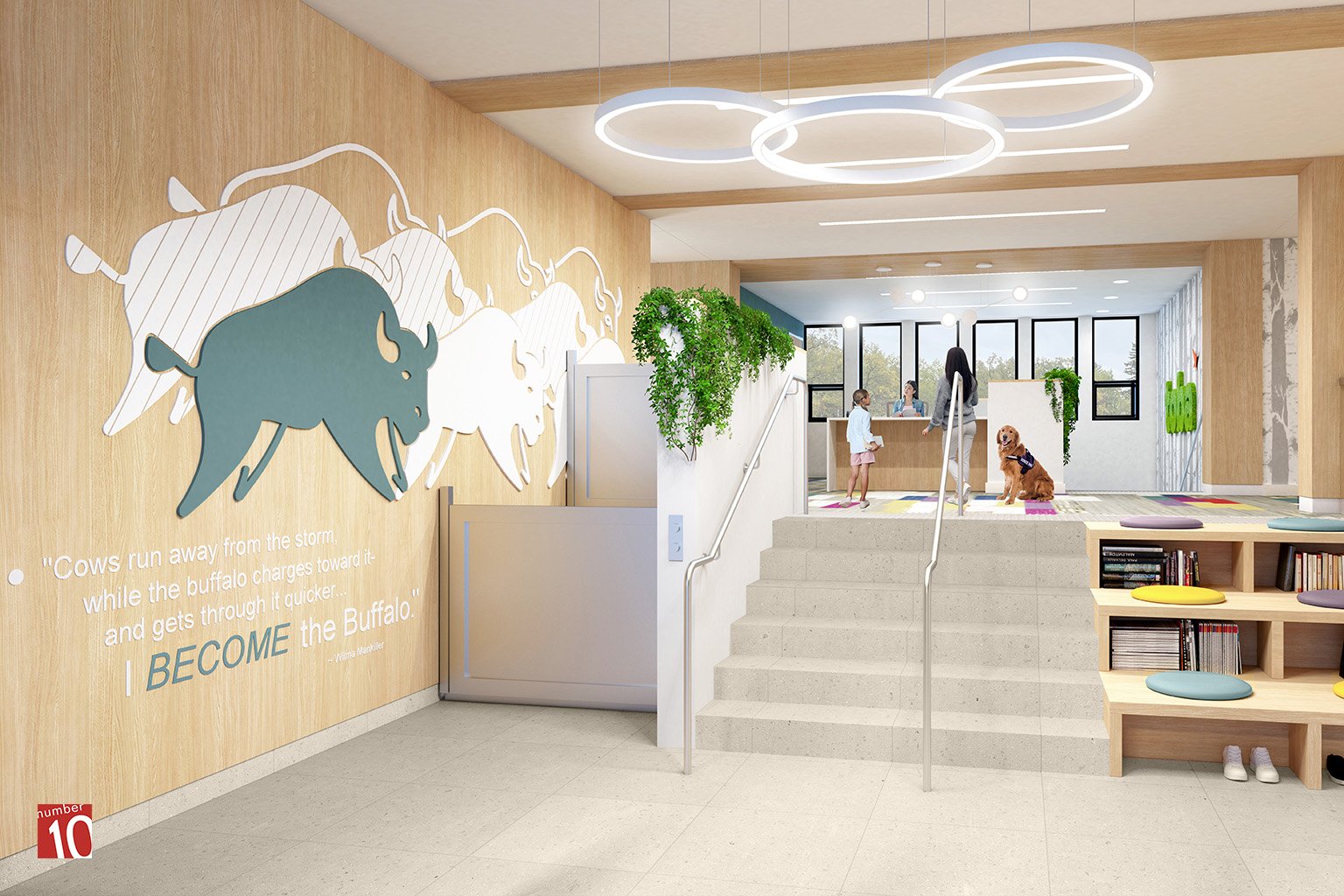 In the lobby of Toba Centre a little girl and her mom are talking to the receptionist. A dog sits on the floor near them.