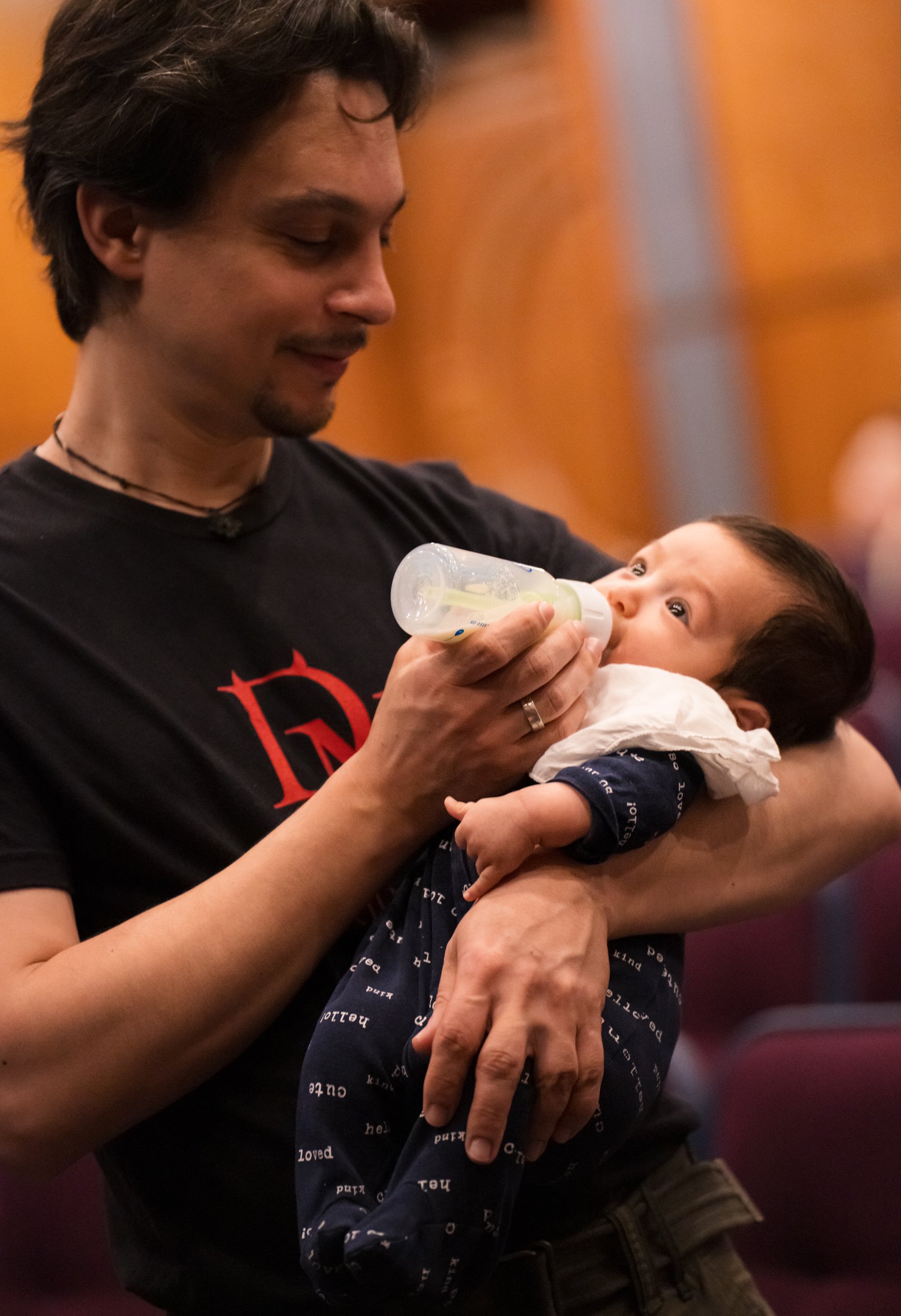  Etienne Gara feeds son Elian during a rehearsal break. Elian was born in January, going on tour five weeks later with violinist parents Etienne Gara and YuEun Kim. 