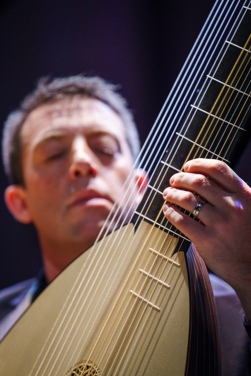  Chris Cockerham plays the theorbo during rehearsal with Philharmonia Baroque Orchestra.  