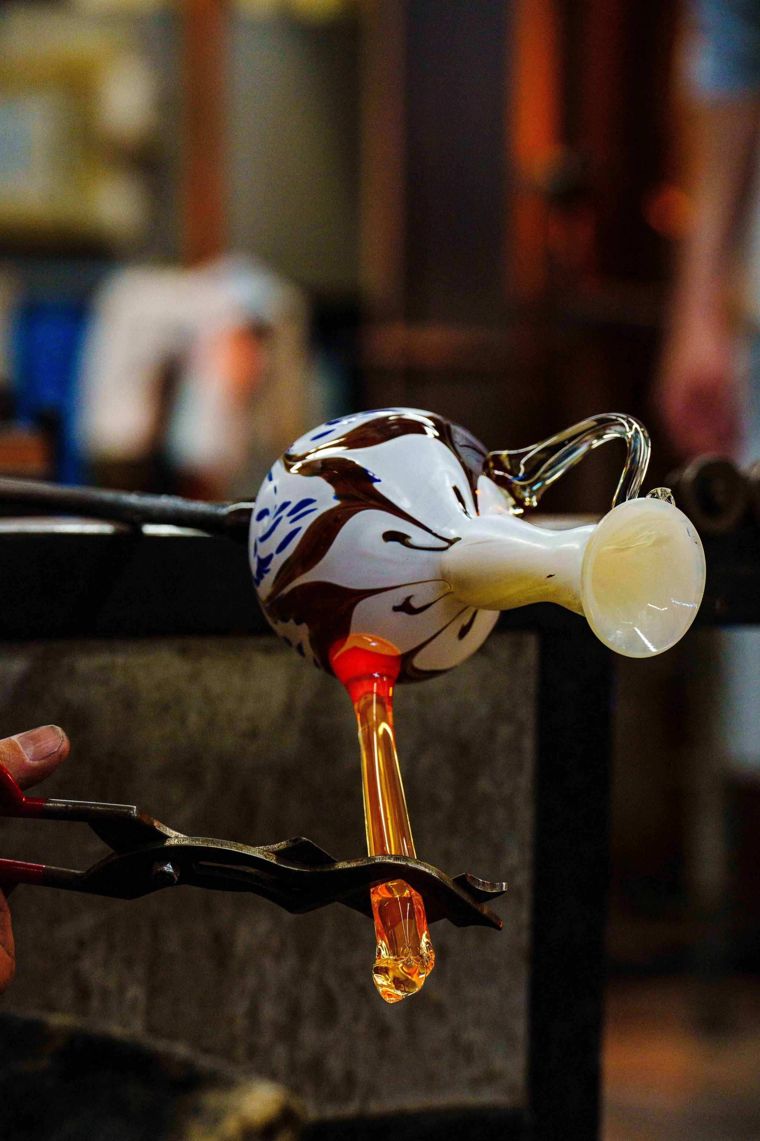  Molten glass shaped into a second handle by Evan Chambers, Monday, April 27, 2026.  