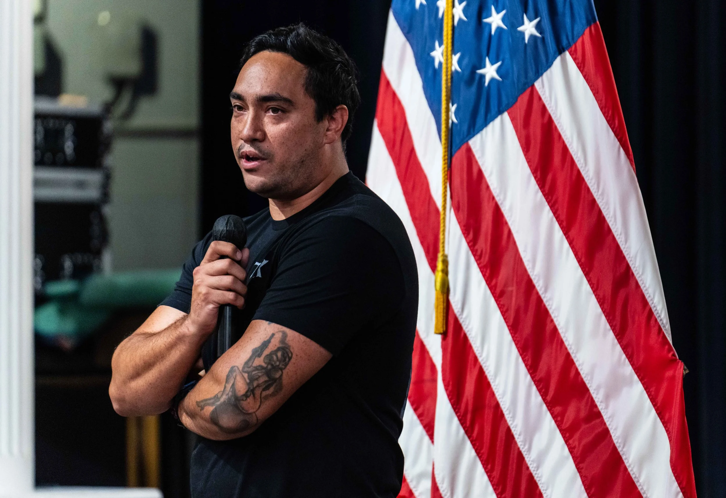  U.S. Navy Veteran Bel Jacob speaks during the luncheon reception. Jacob said Romano persuaded him to take on leadership roles, especially within national club organization Student Veterans of America, and convinced him to join the American Legion, w