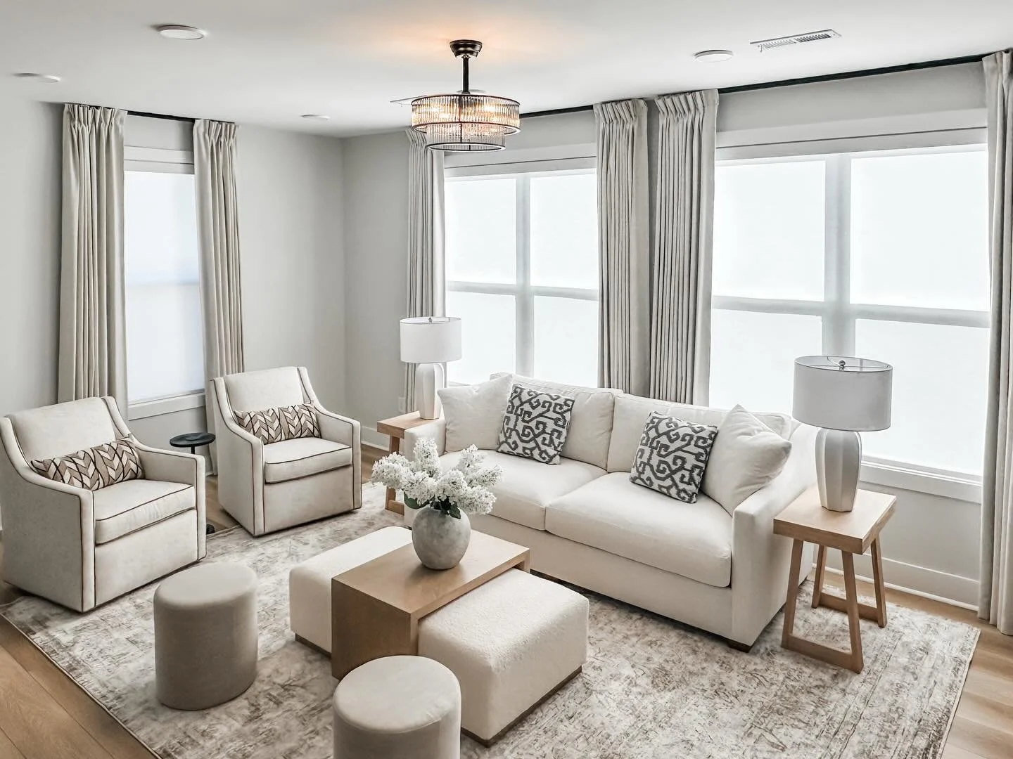 Cozy, timeless, and made for real living! Neutral layers, warm finishes, and the perfect ottoman + coffee table combo to put your feet up and truly relax. My client wanted all neutrals and a relaxing space to come home to and that is what we accompli