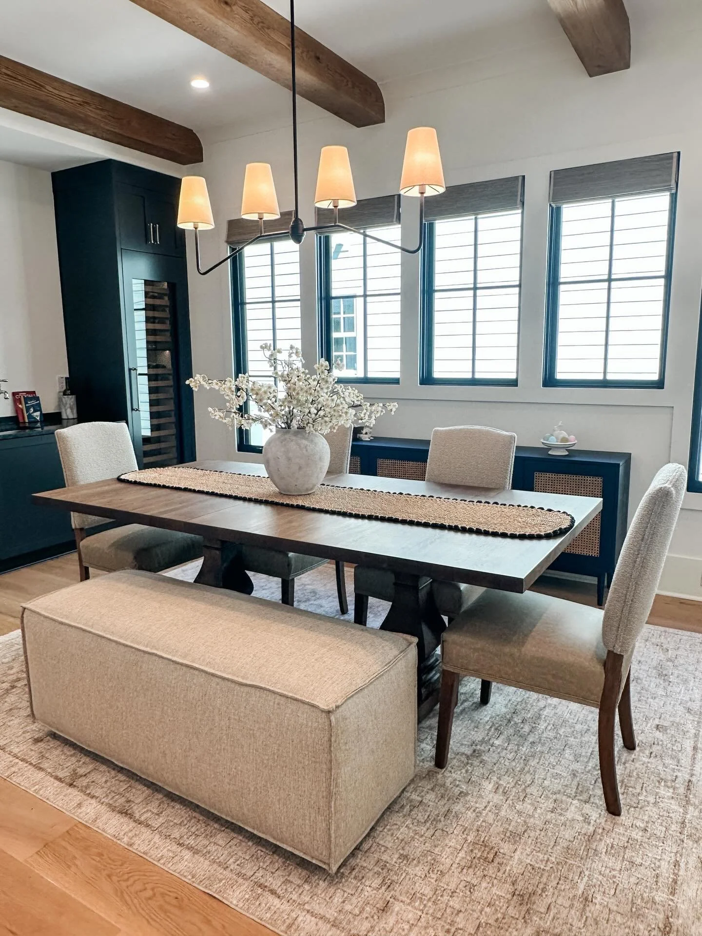 Who says a dining room has to feel boxed in?

This space was designed to flow&mdash;literally. By swapping traditional chairs on one side for a bench seat, we kept the sightlines open and the room feeling airy, not overcrowded. It&rsquo;s one of thos