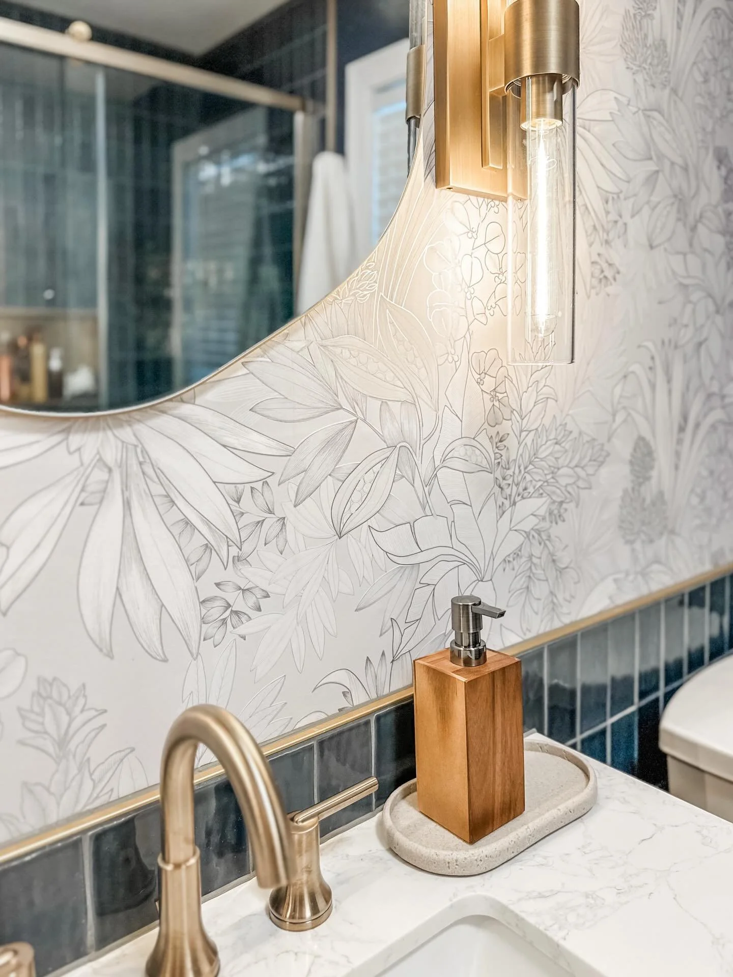 We leaned into a bold wallpaper moment to give this space personality, but kept the overall palette grounded with masculine tones so it still feels elevated when guests stop by. The result? A bathroom that grows with the kids and doesn&rsquo;t skip a