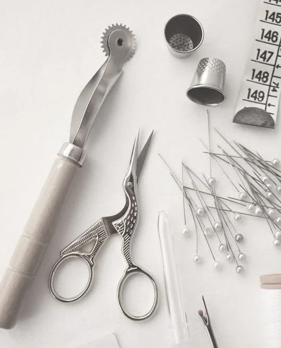 It takes more than silk and lace to make a gown bespoke.
It takes the notions — the quiet materials that never show,
but make all the difference.
Horsehair for structure.
Boning for shape.
Invisible zippers. Hand-covered buttons.
Layers