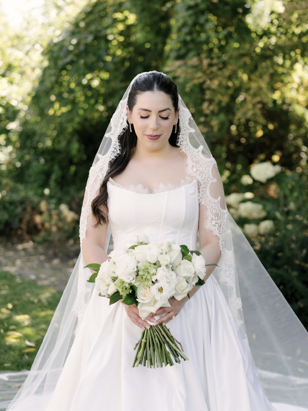 Heirloom Portraits

Portraits worthy of preservation.

A hand-beaded mantilla veil, layers of Chantilly lace, and a sculptural box-pleated skirt cut from double-faced silk peau de soie &mdash; chosen for the kind of depth and softness that only becom