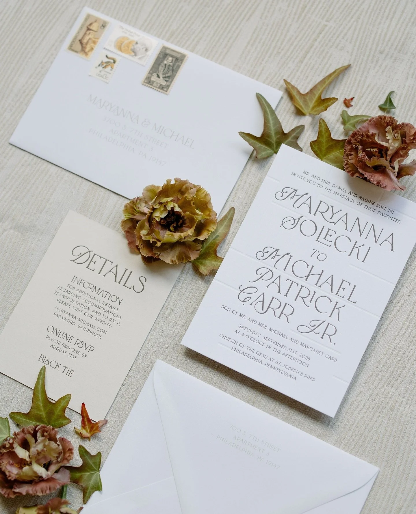 For Maryanna &amp; Michael, every detail of their invitation suite was rooted in place and story. The invitation rests on a blind letterpress backdrop echoing the stone walls of The Barnes Foundation, where their reception unfolded. A double-sided de